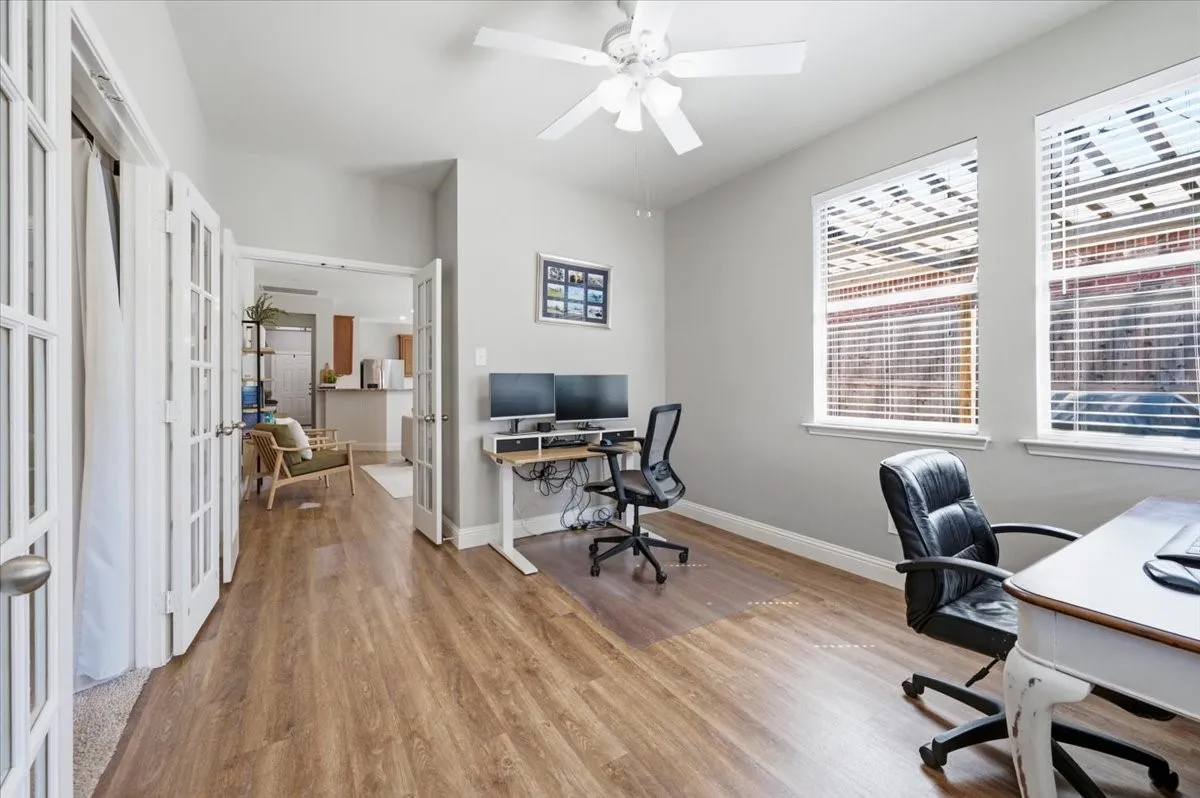Just off the primary bedroom and open to the living area. Abundant natural light. Great space for an office or could be a hobby or reading room.