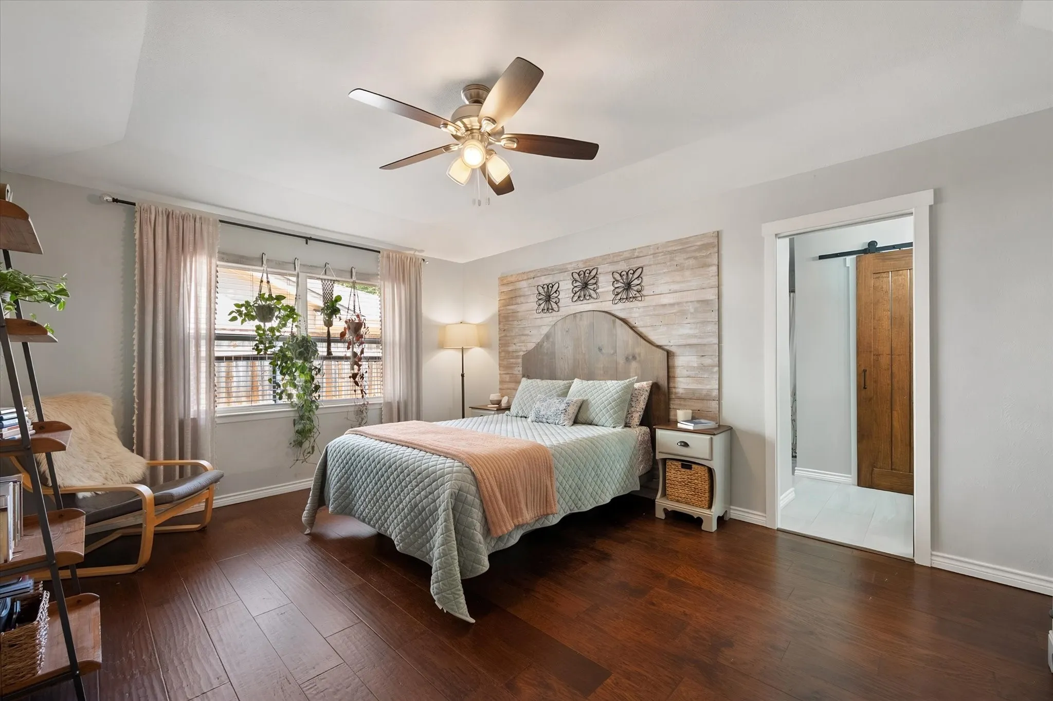 Primary Bedroom with large window adding natural lighting