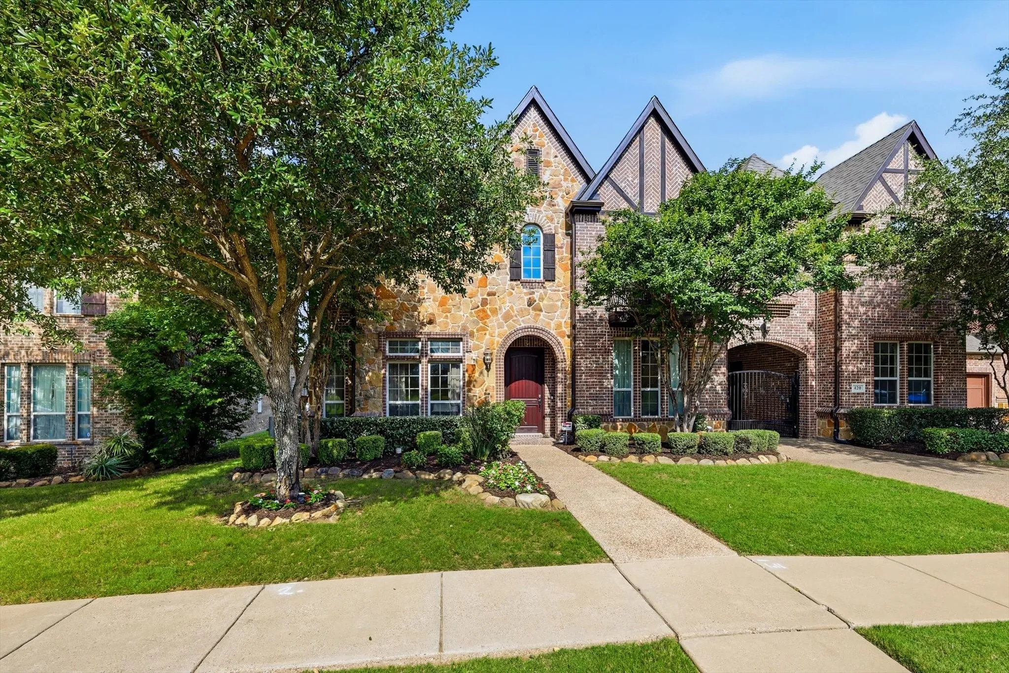 Stone and brick exterior with Tudor-style gables
