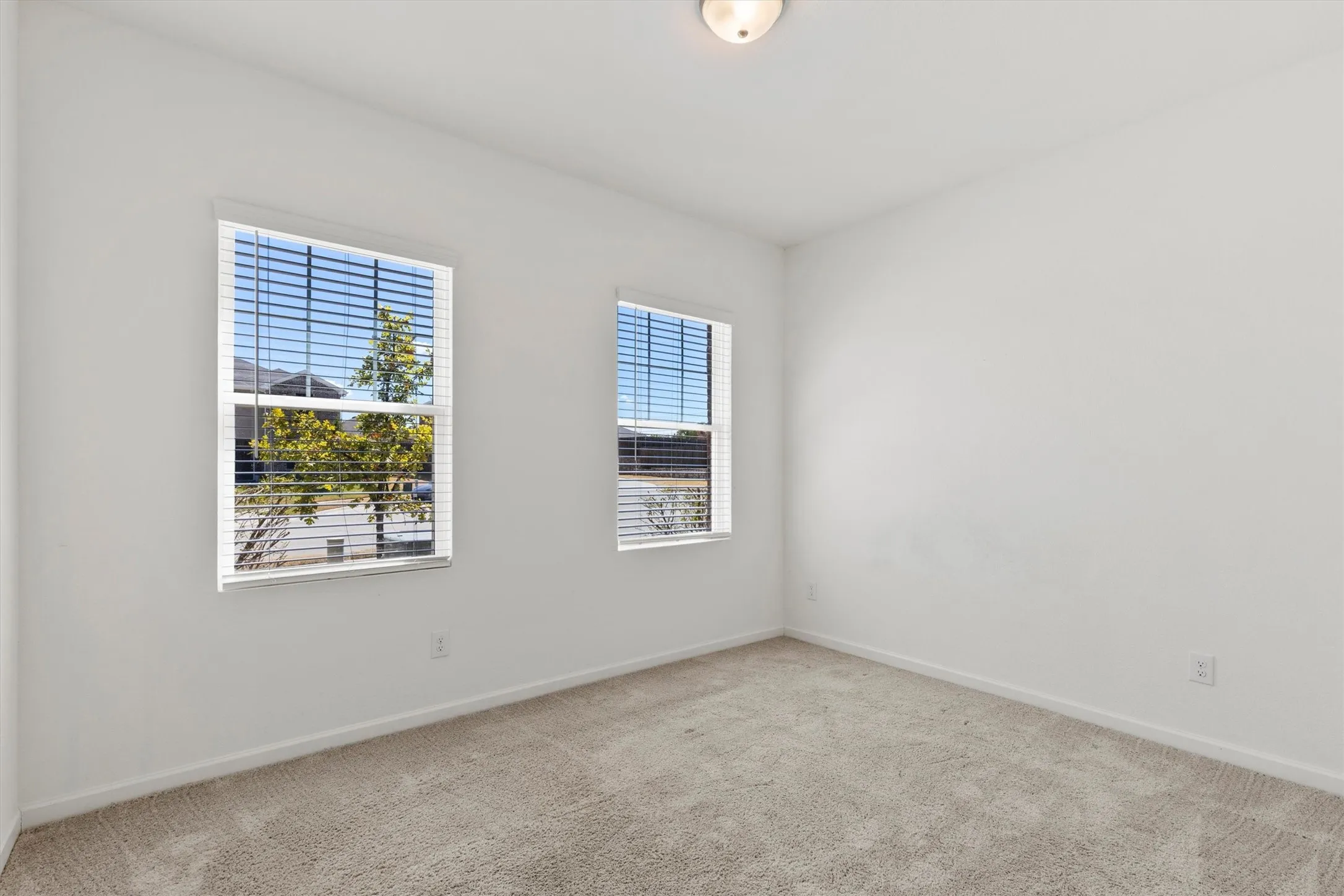 Secondary bedroom with ample natural light.