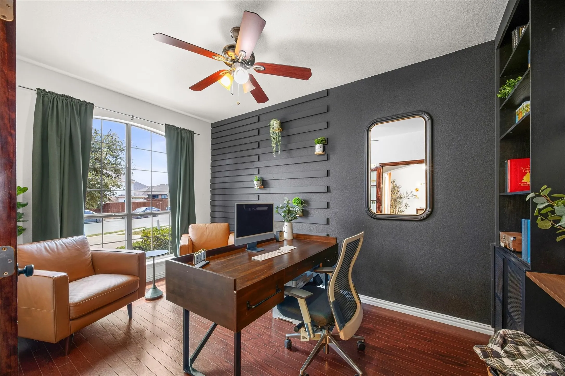 Designer paint and shelving adorns the office.