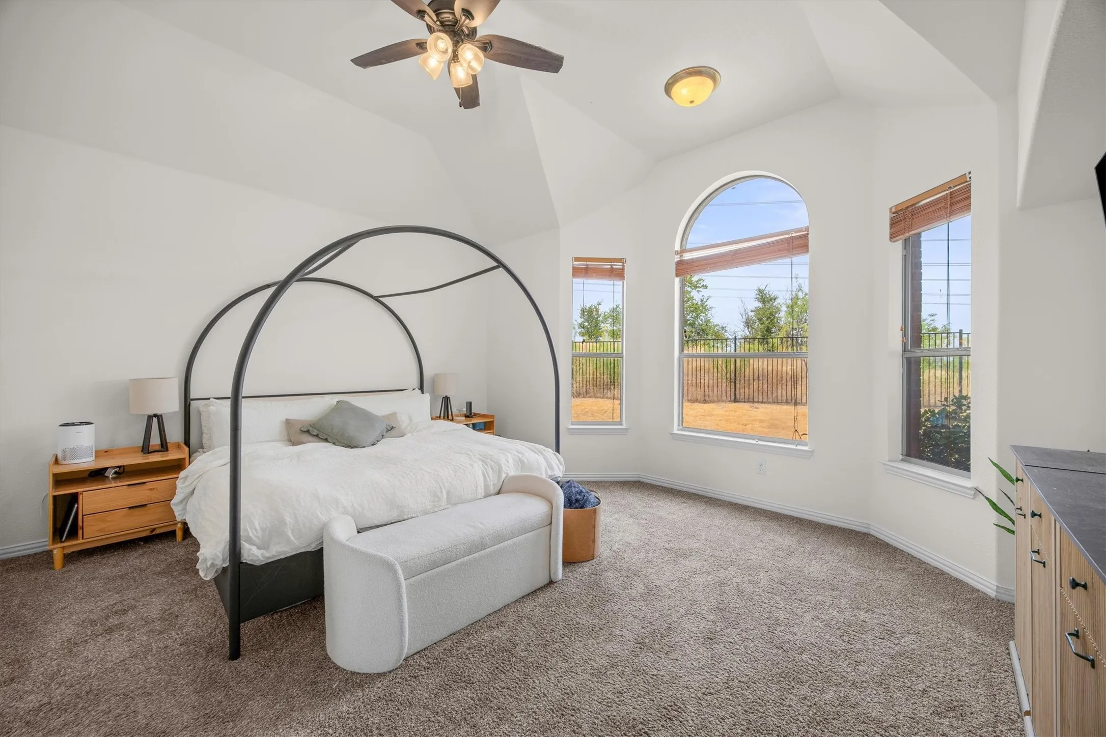 The master bedroom has high ceilings as well.