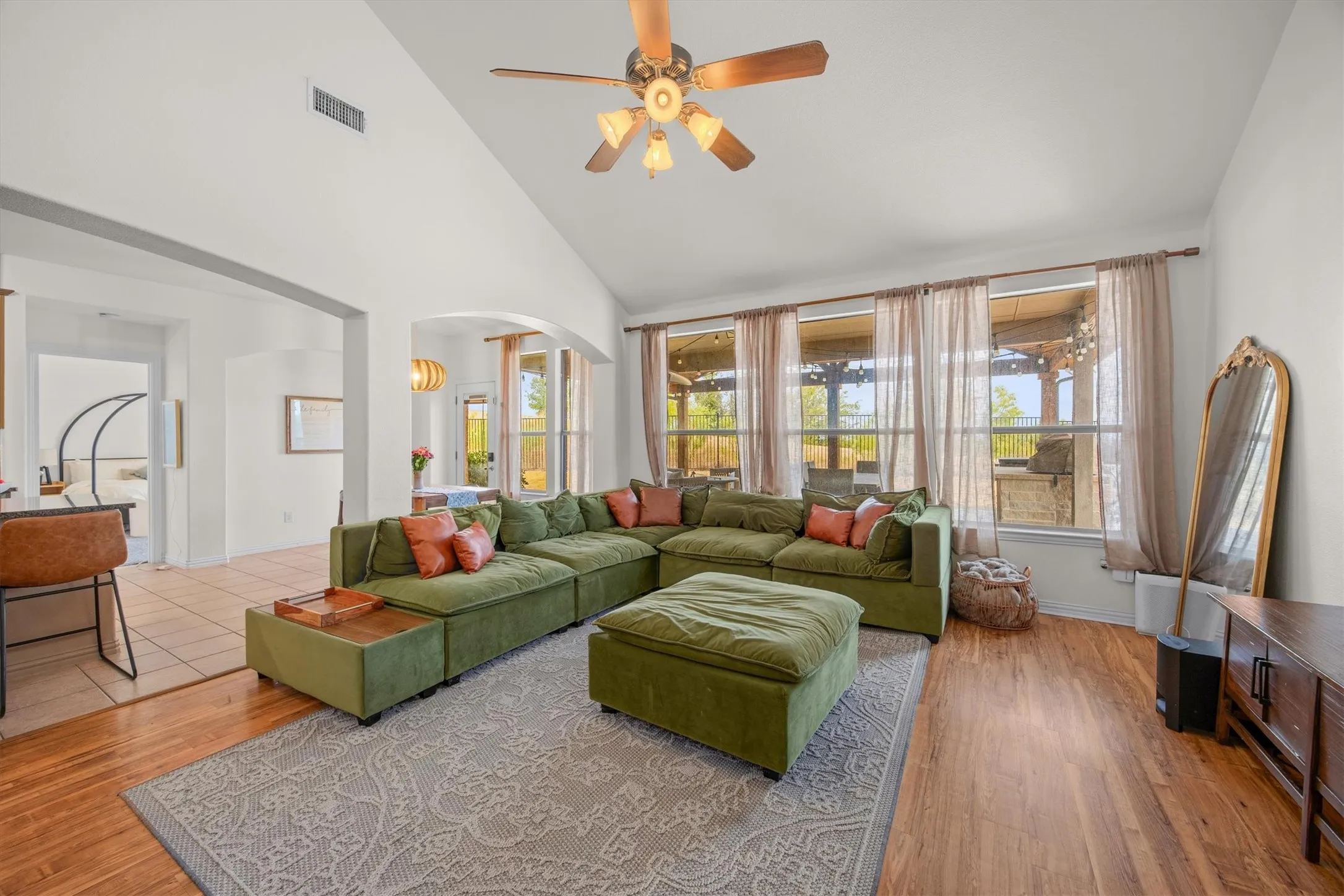 This room is very spacious and overlooks the backyard pool and patio.