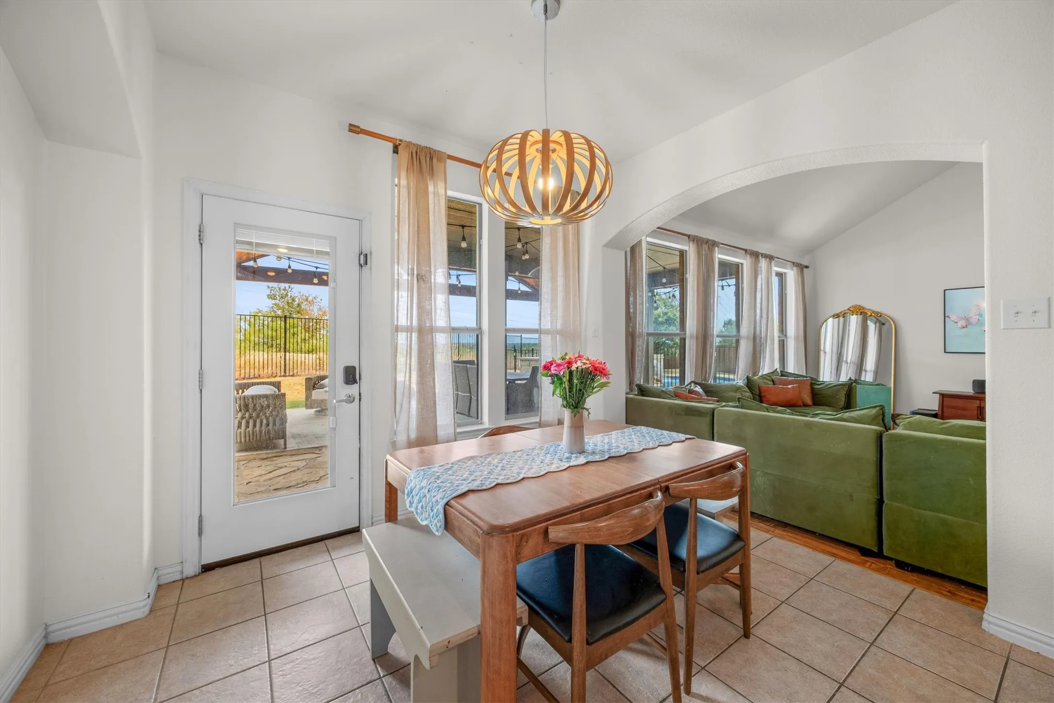The breakfast room has a view to the spectacular backyard.