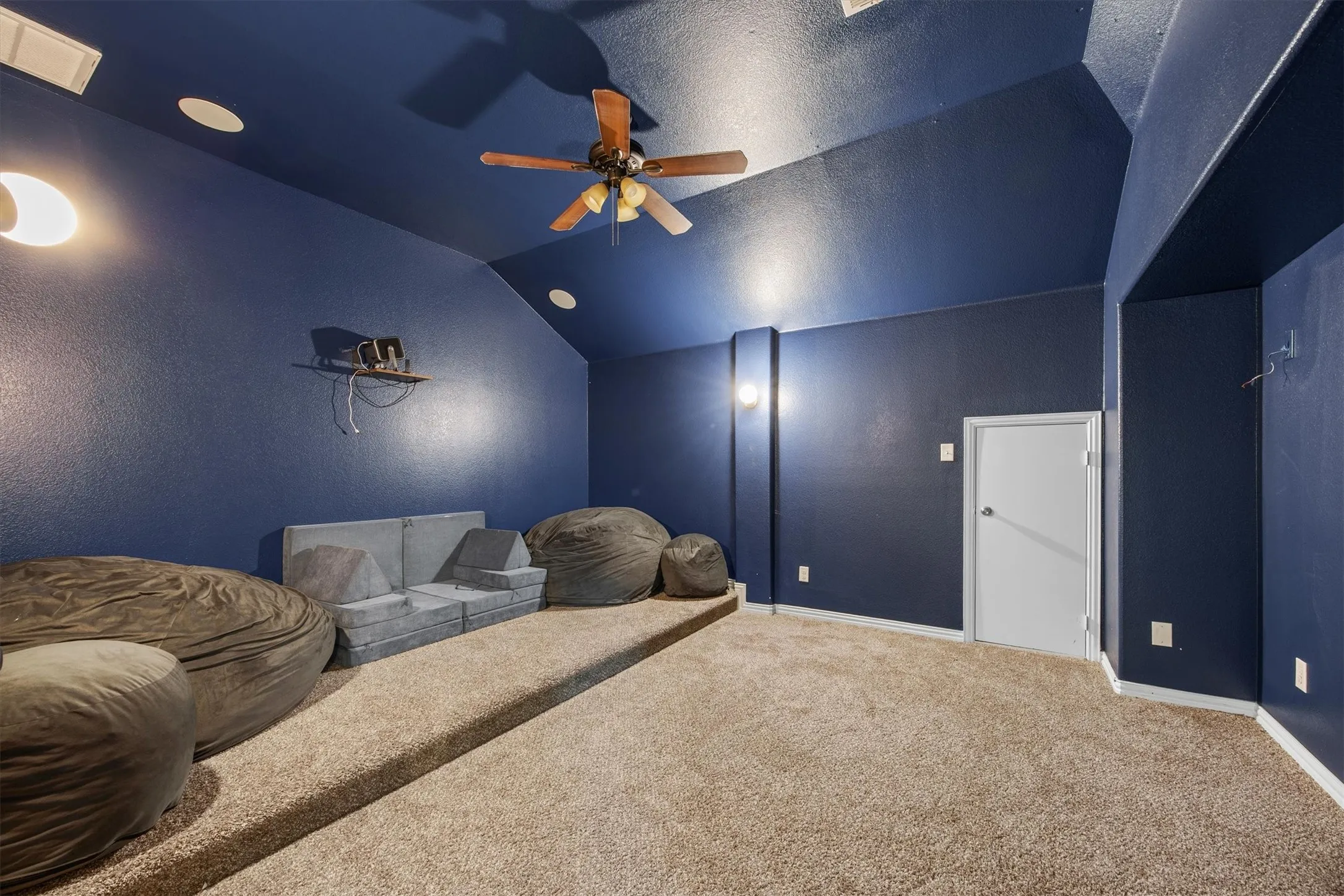 The media room is located off of the game room. It is fully wired to speakers.