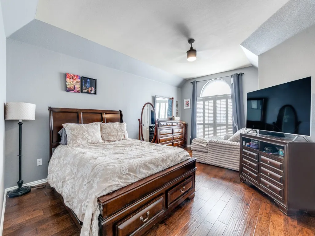 Primary with sitting area. Wood-finish flooring throughout