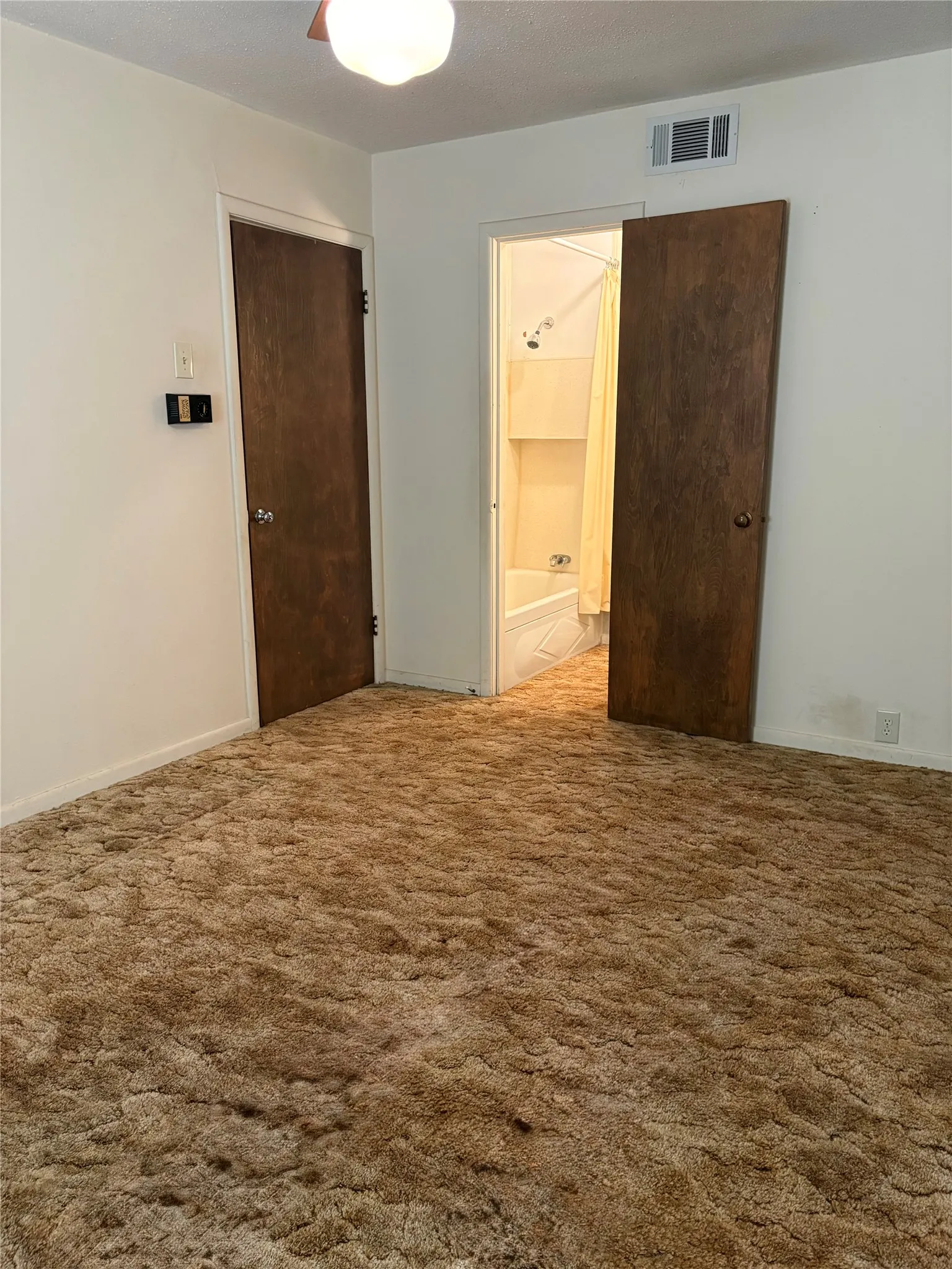 Large second primary bedroom with bathroom adjacent.