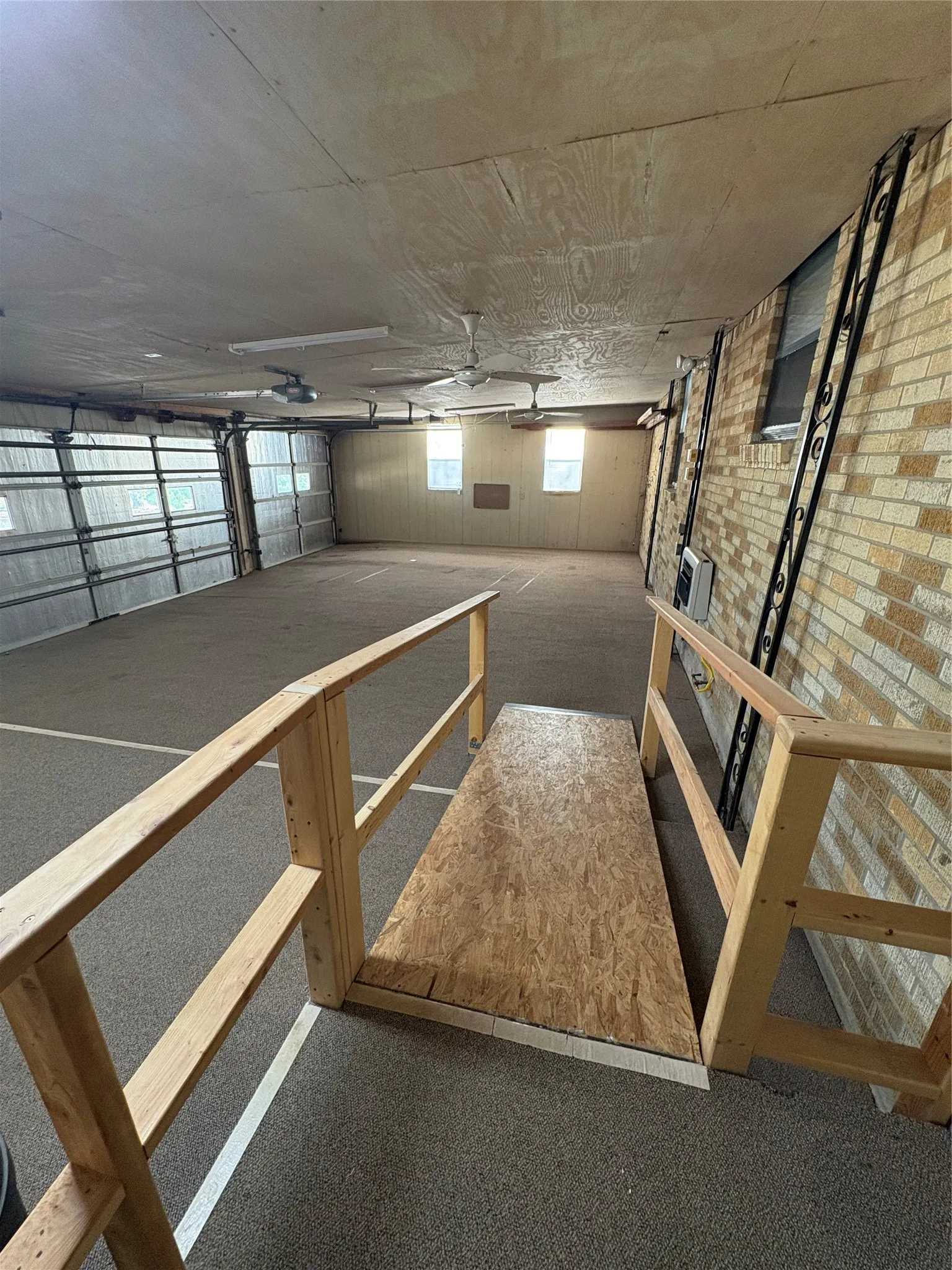 Three car garage with accessibilty ramp.