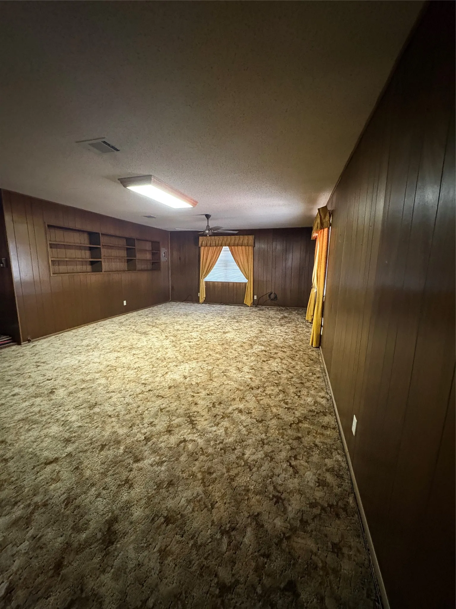 Large den with built in cabinets