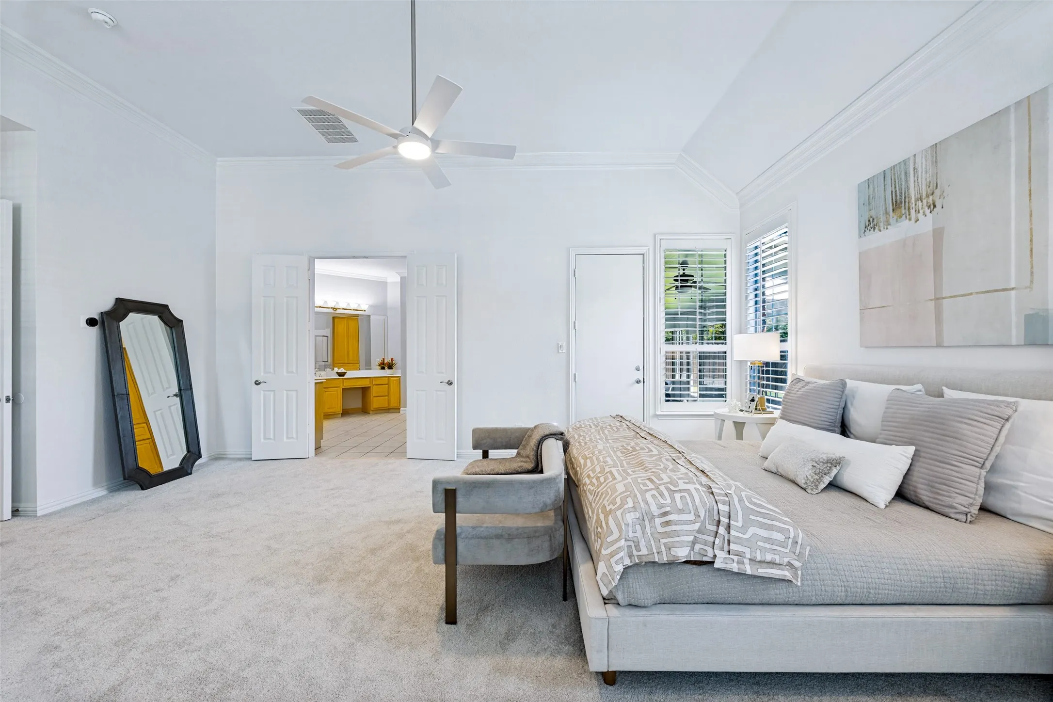 Vaulted ceilings with crown molding, double French doors, large windows with blinds, a ceiling fan, and light-colored carpeting, brand new