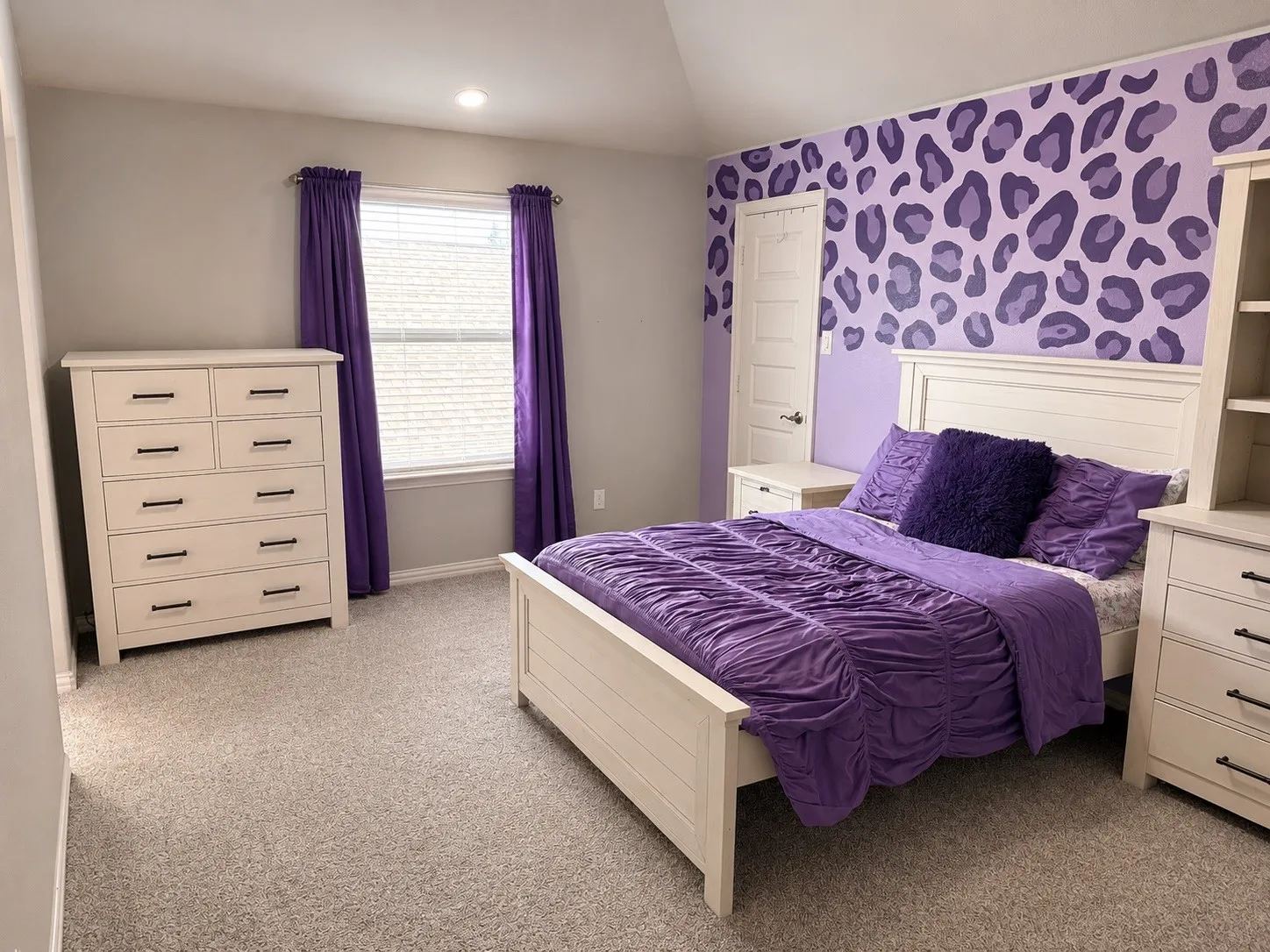 Bedroom 3 with a ceiling fan, carpet, large walk in closet and jack and jill bathroom.