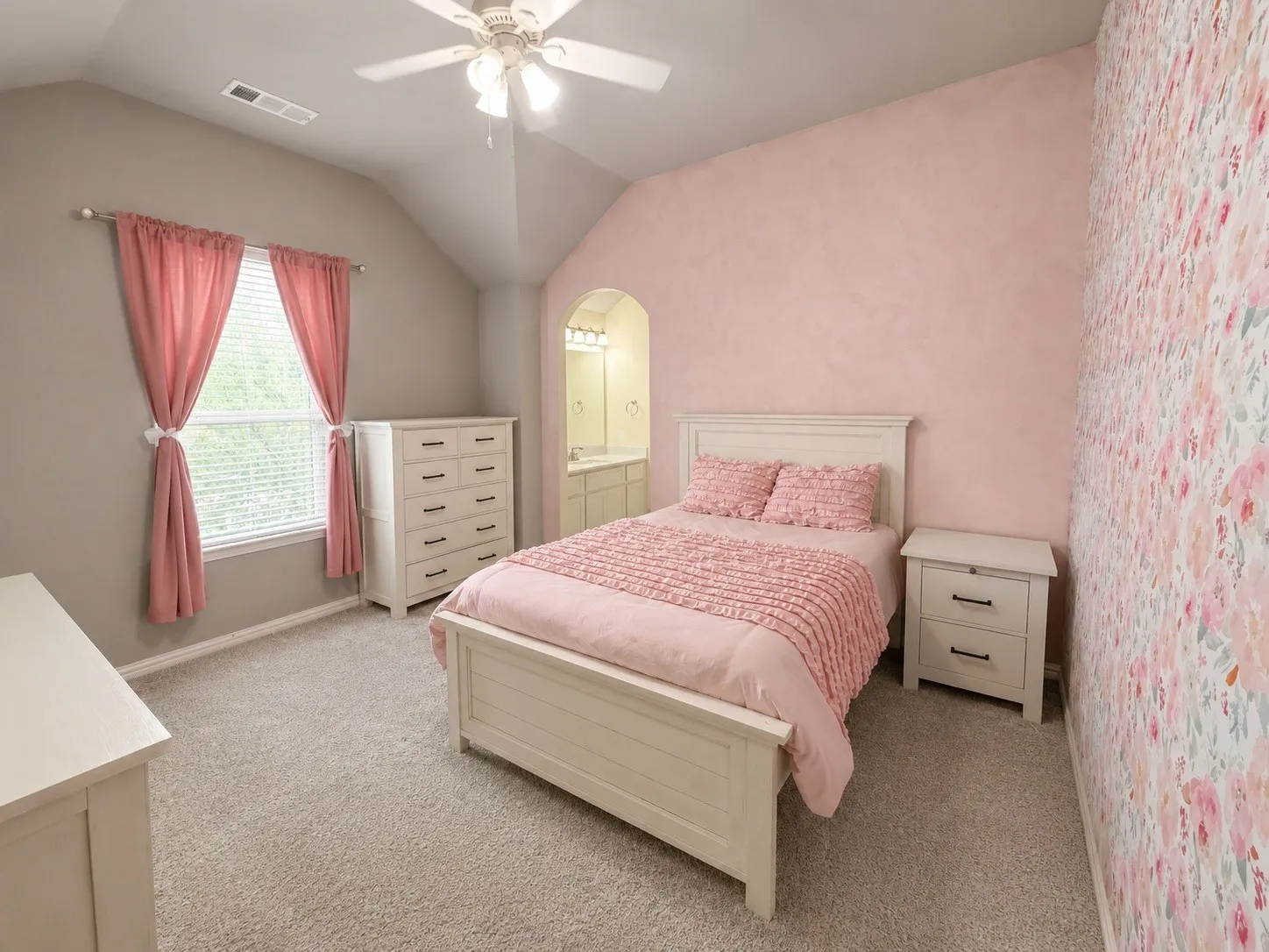 Bedroom 4 with a ceiling fan, carpet, large walk in closet and jack and jill bathroom.