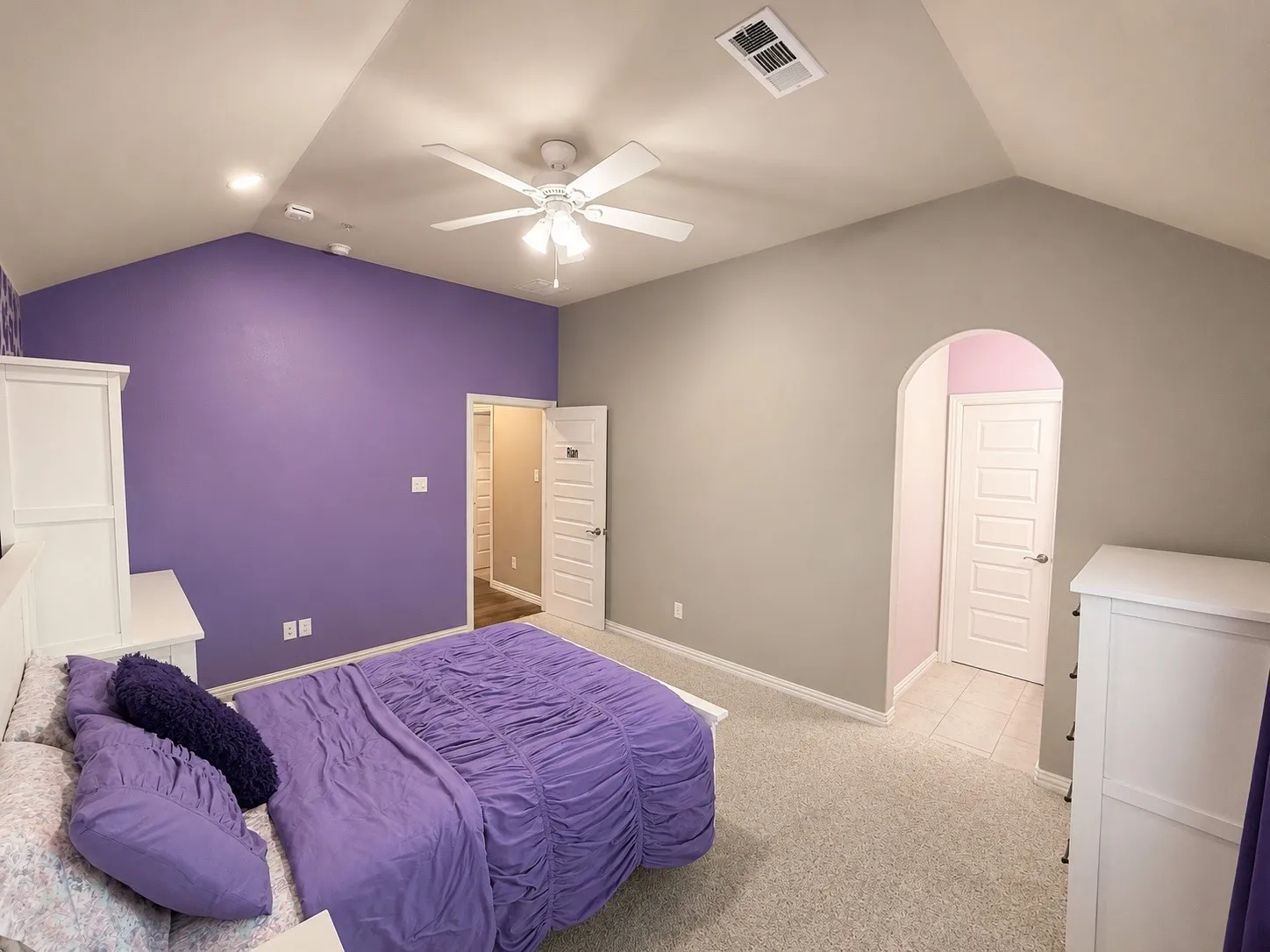 Bedroom 3 with a ceiling fan, carpet, large walk in closet and jack and jill bathroom.