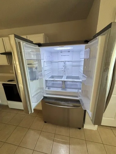 Stainless steel French door refrigerator with bottom freezer