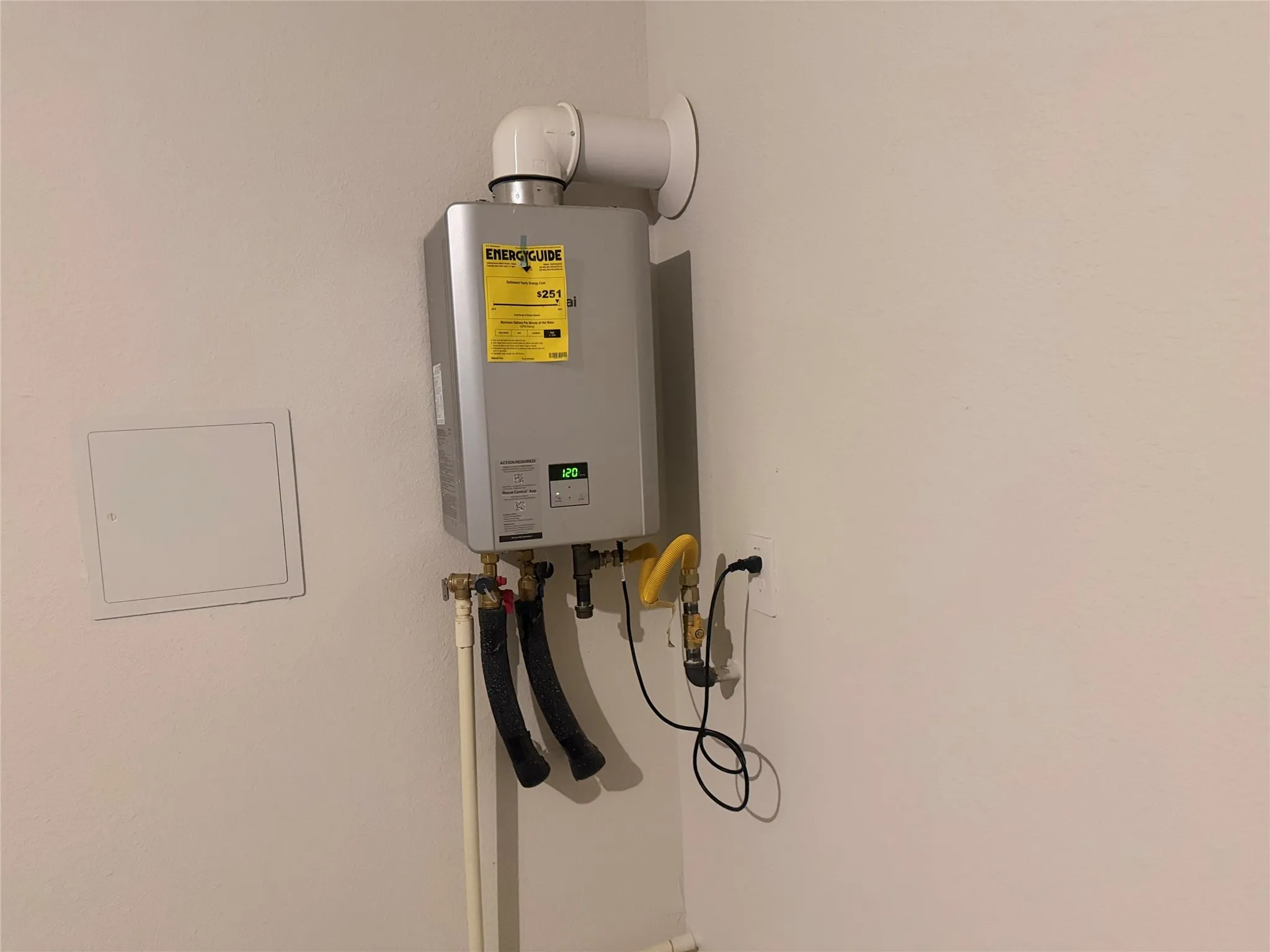 Tankless water heater with visible energy guide