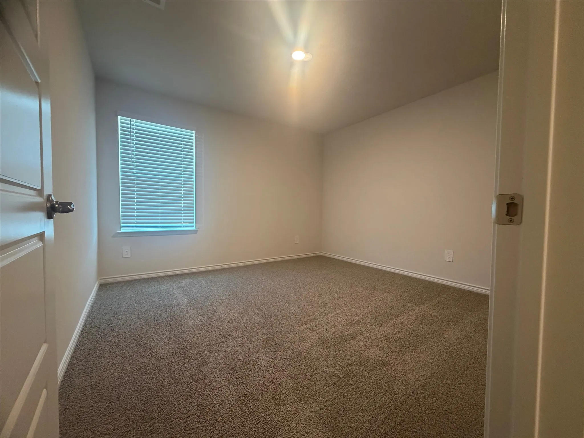Bedroom 4 -Neutral wall paint with carpet flooring