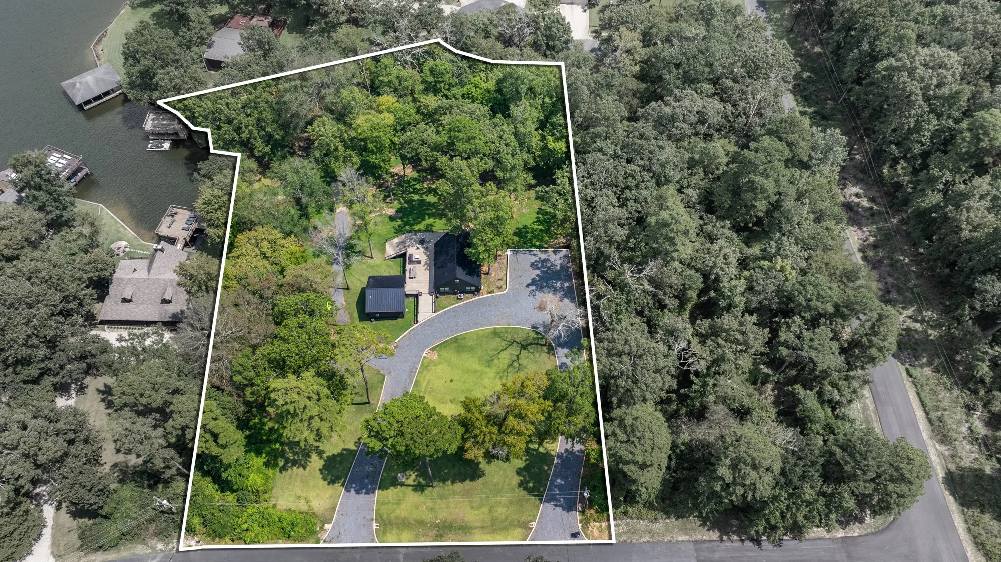 Aerial view of property and surrounding area with property boundaries highlighted