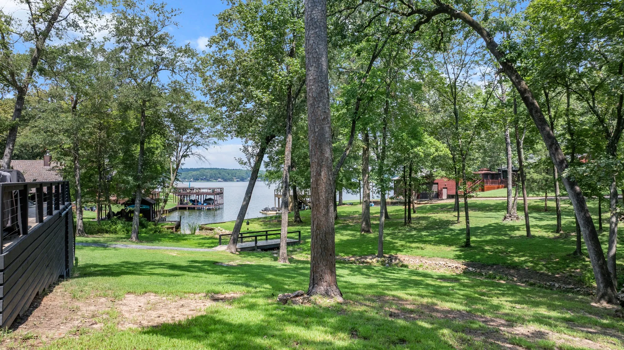 View of grassy yard with a water view