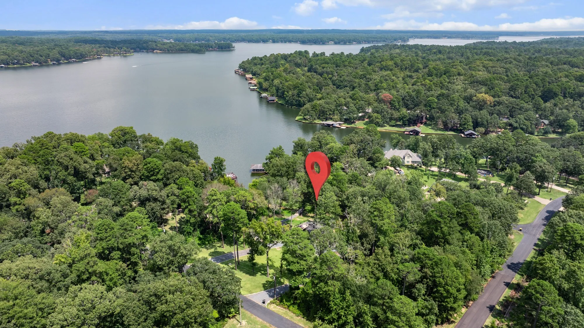Aerial view of property's location featuring a nearby body of water