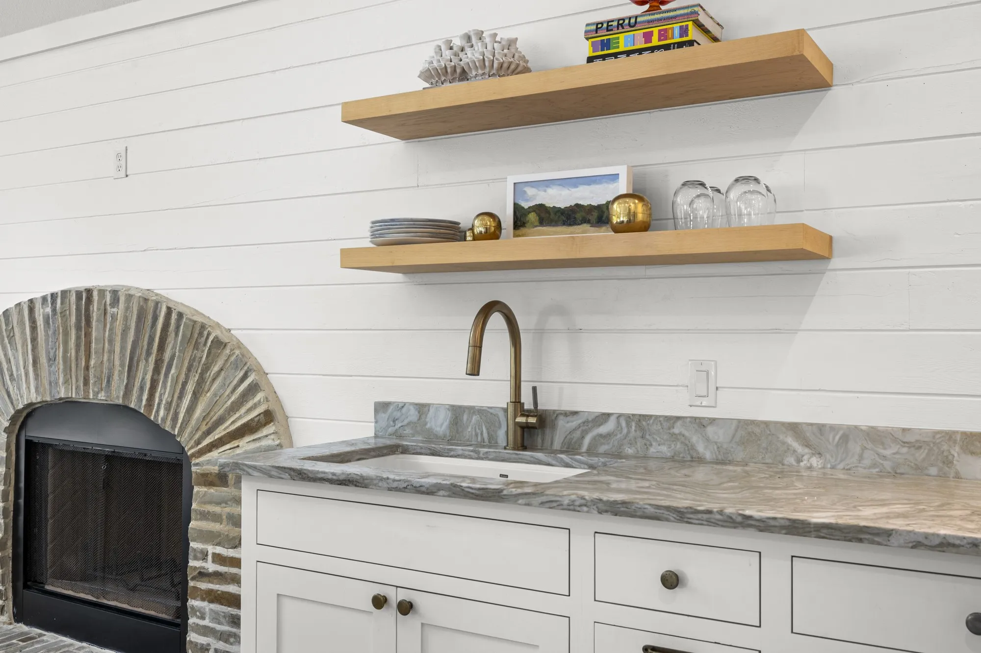 Detailed view of a sink and a fireplace