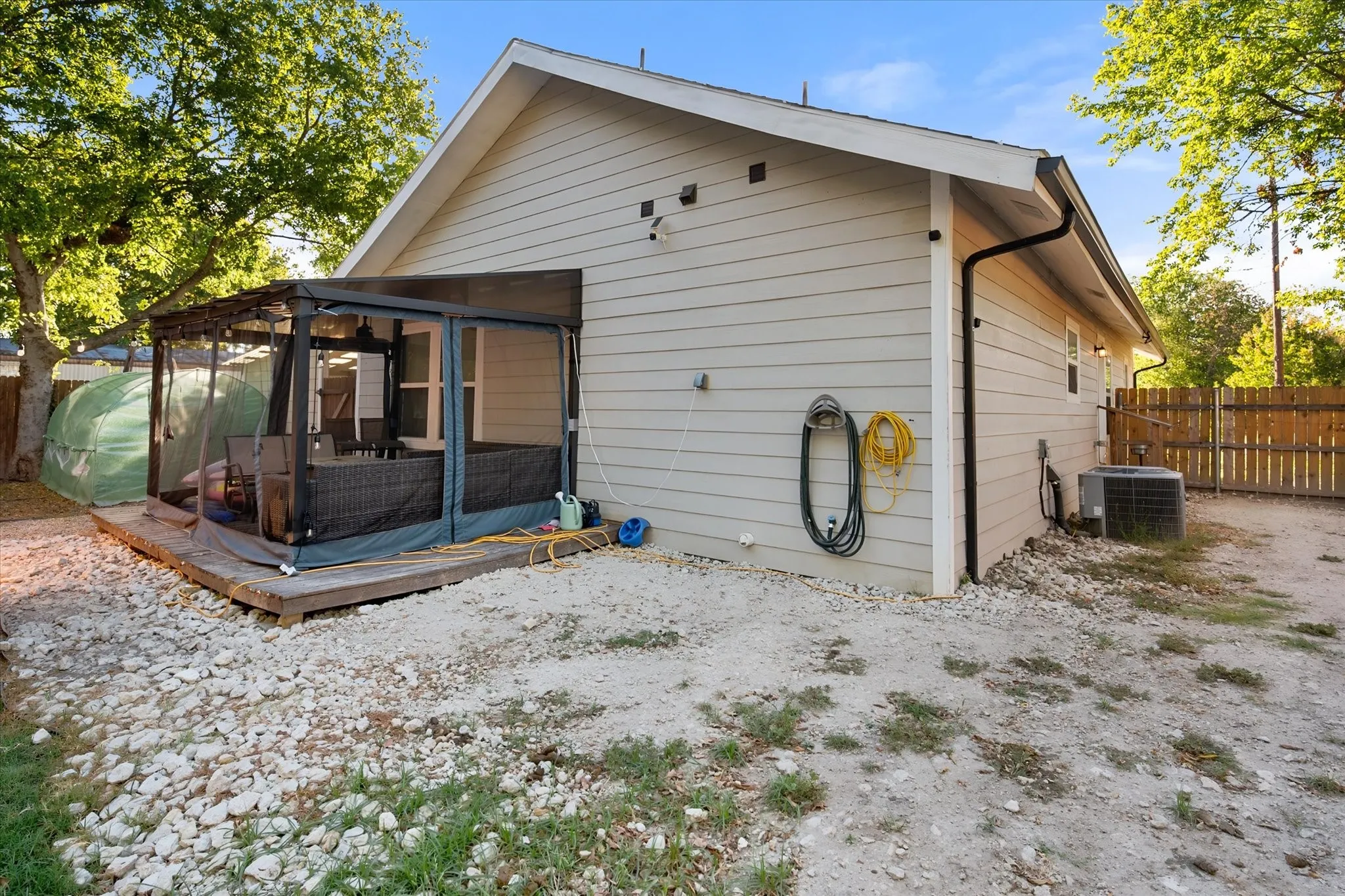 Deck with covered patio. Has a ceiling fan