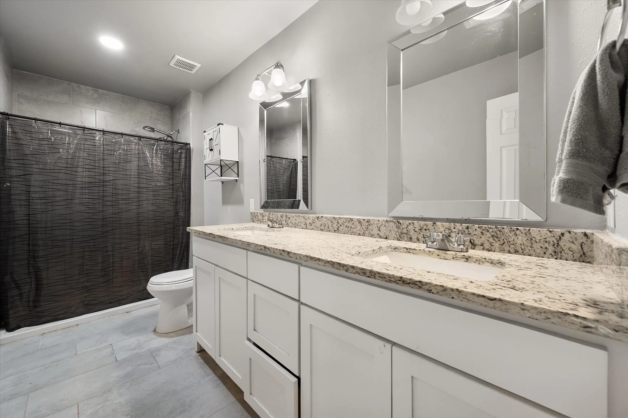 Full shower with dual sinks