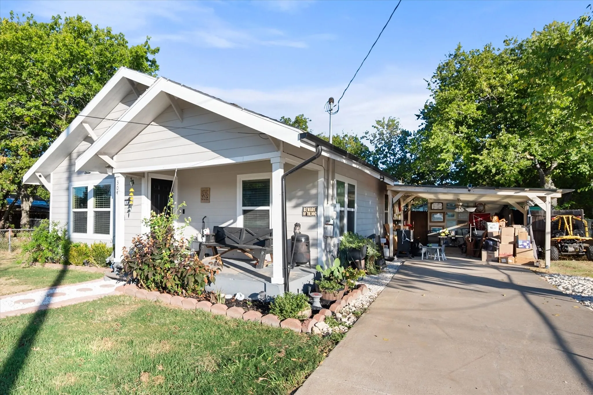 Super cute porch and view of the car port