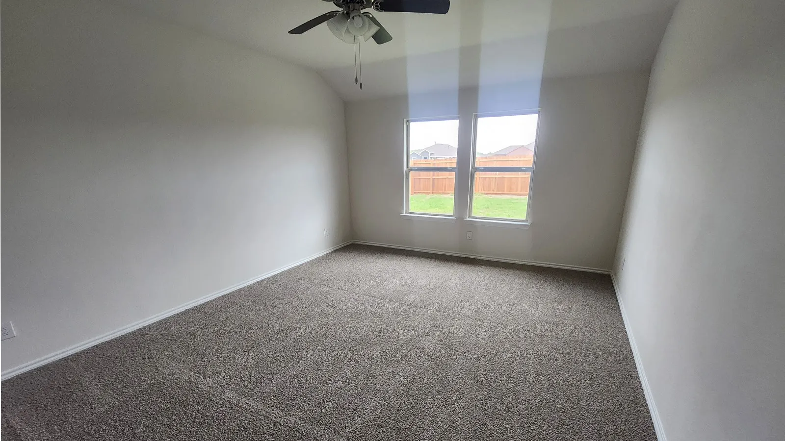 Neutral-toned carpeting paired with light-colored walls