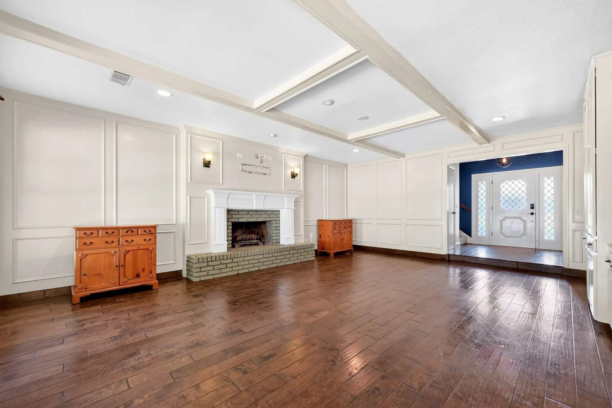 Living room with fireplace and wood flooring