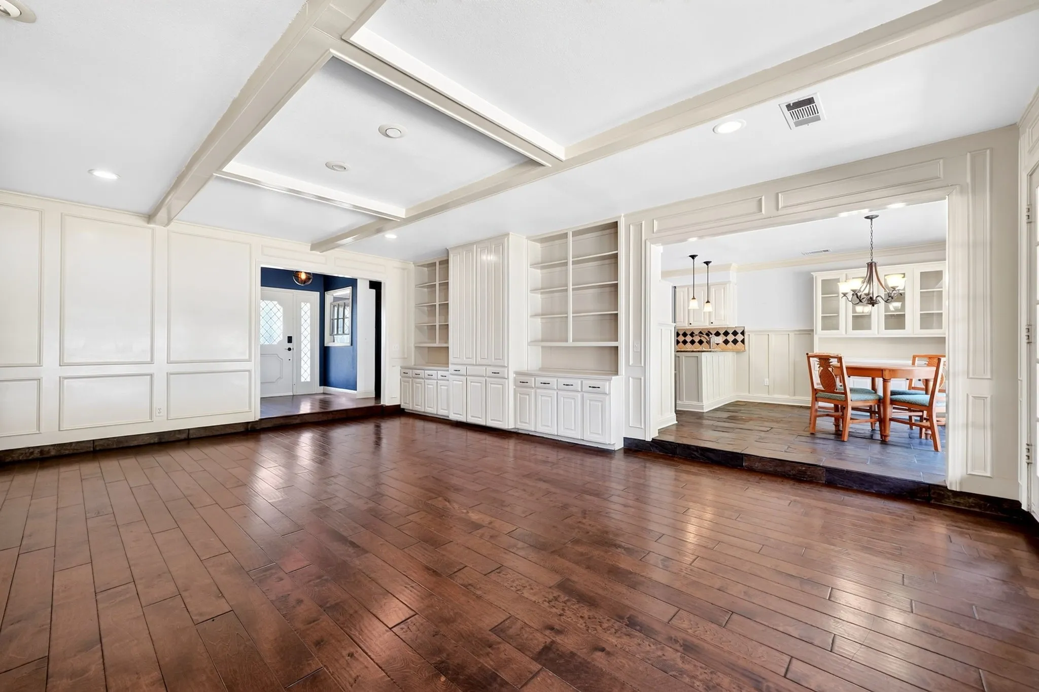Living room that leads to kitchen nook.