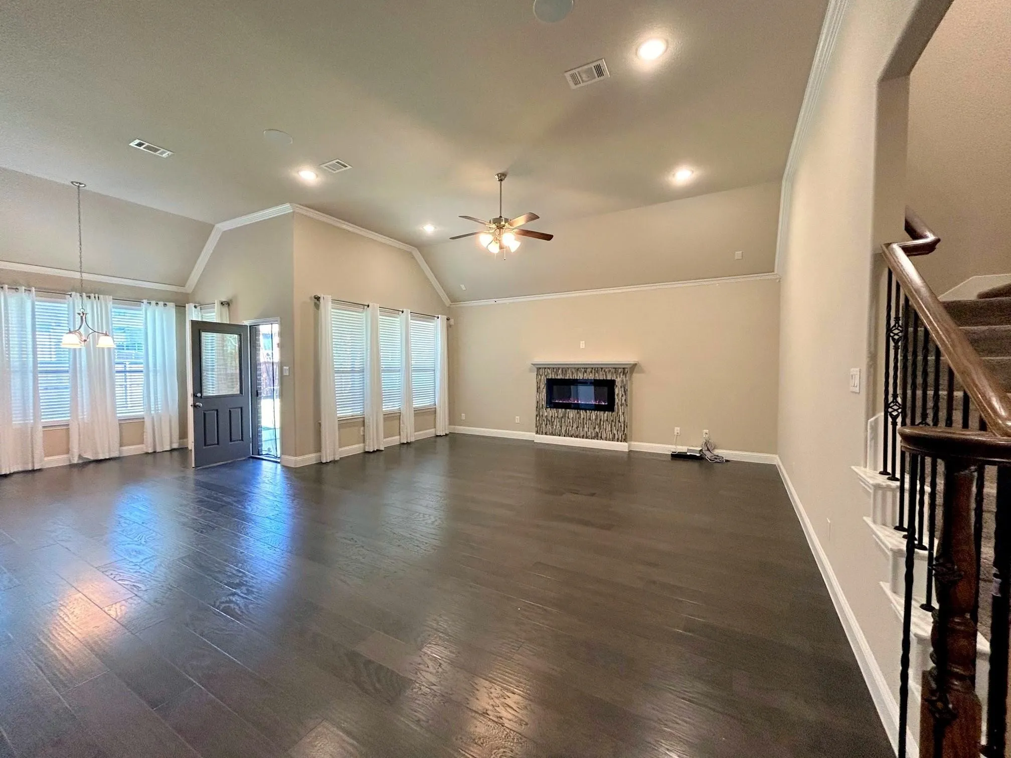 Living area with the view of the eating area.  Door leads to the backyard with a covered patio.