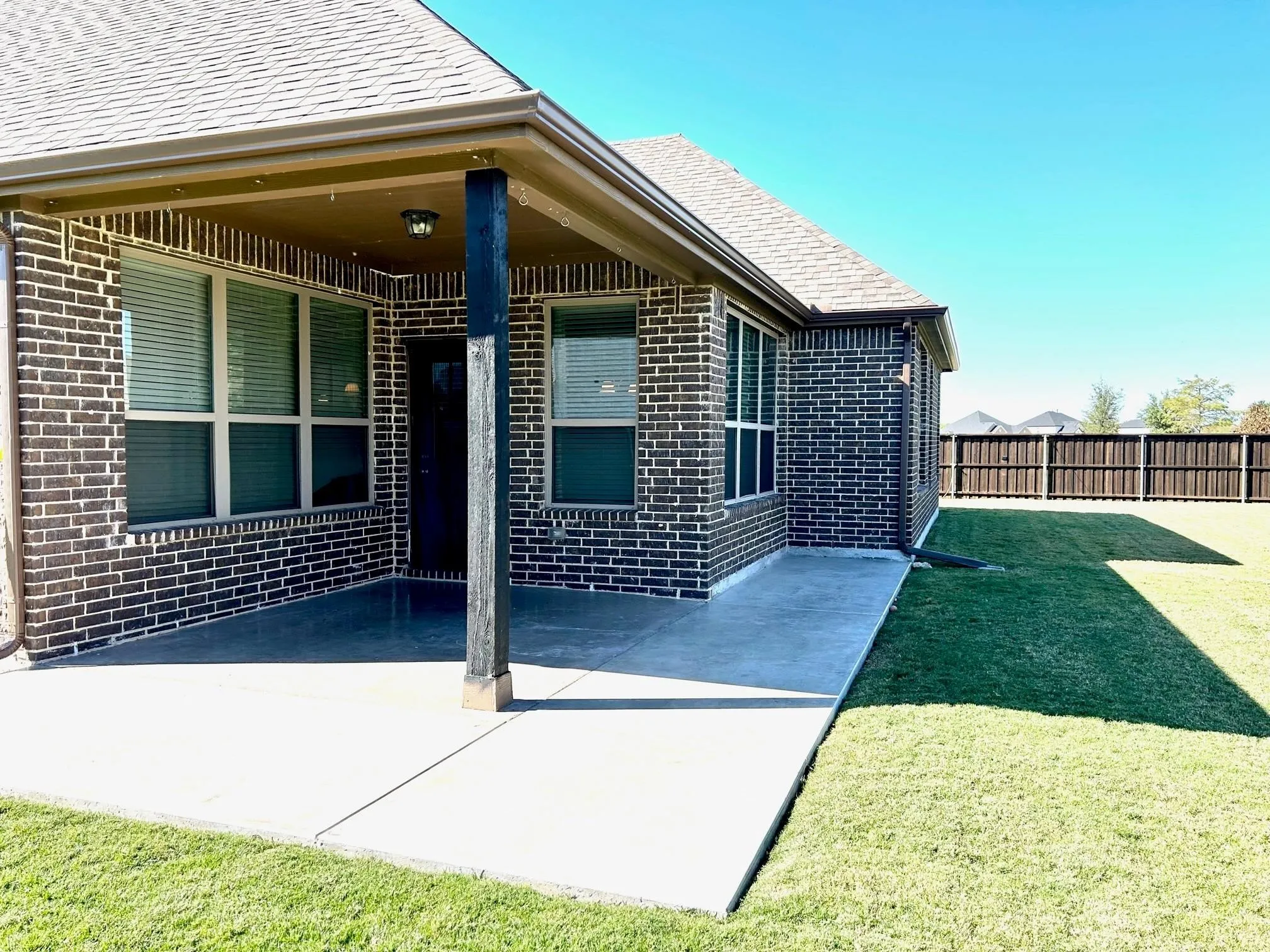 backyard patio.  This home sits on a corner lot and the backyard is large.