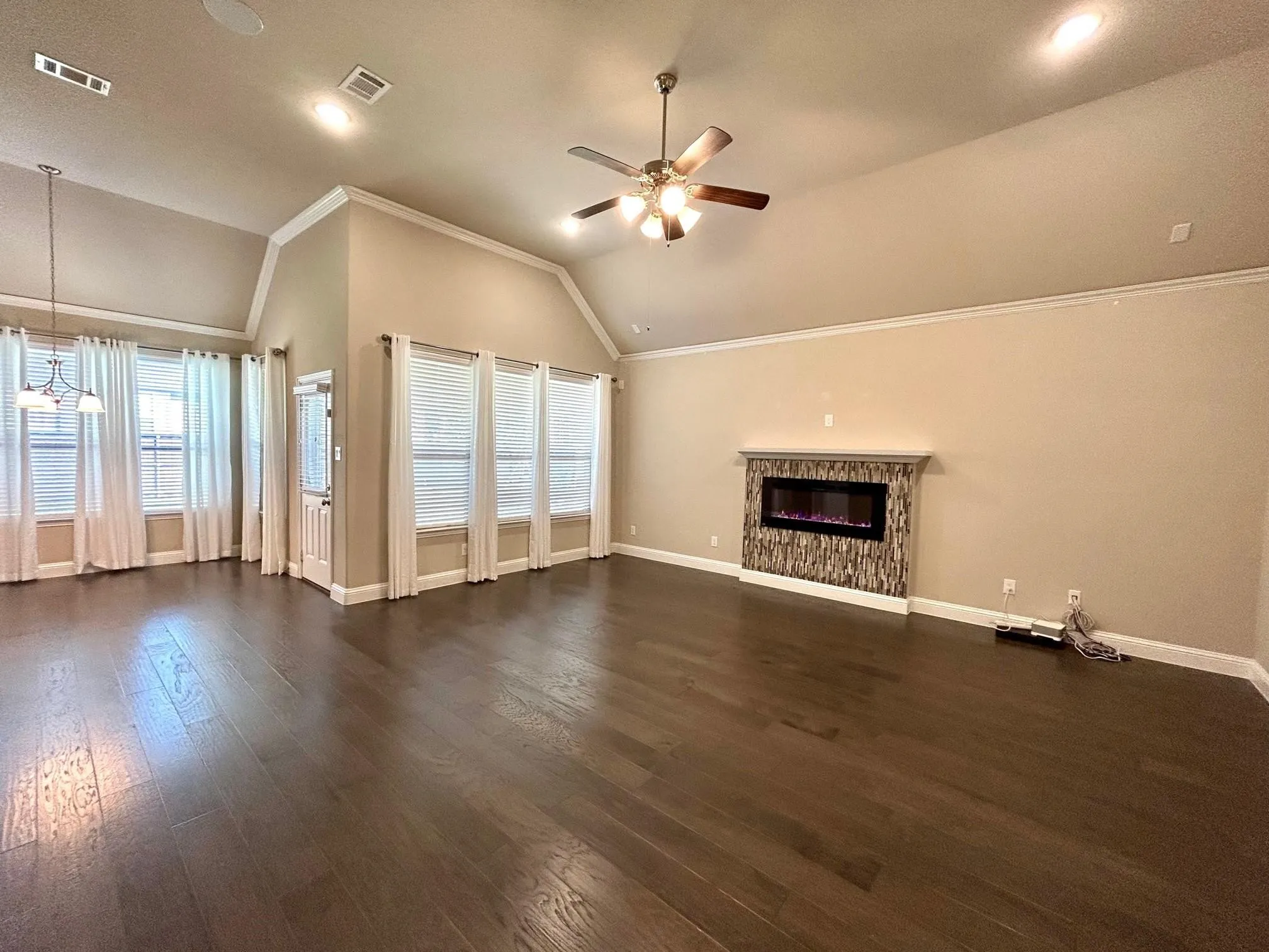 Large living area with gas fireplace.