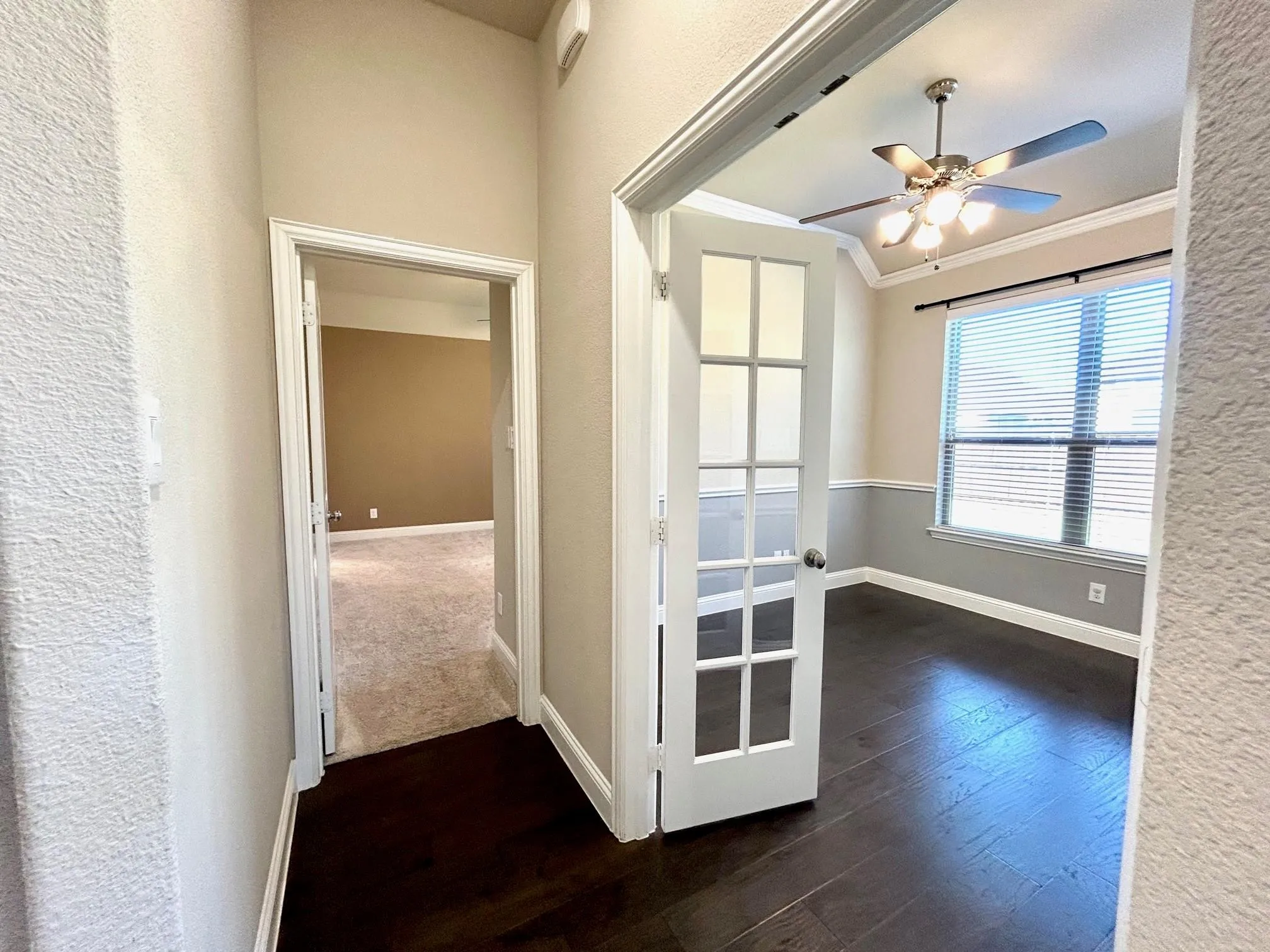 Through the french doors is the study.  The other door leads to the primary bedroom.