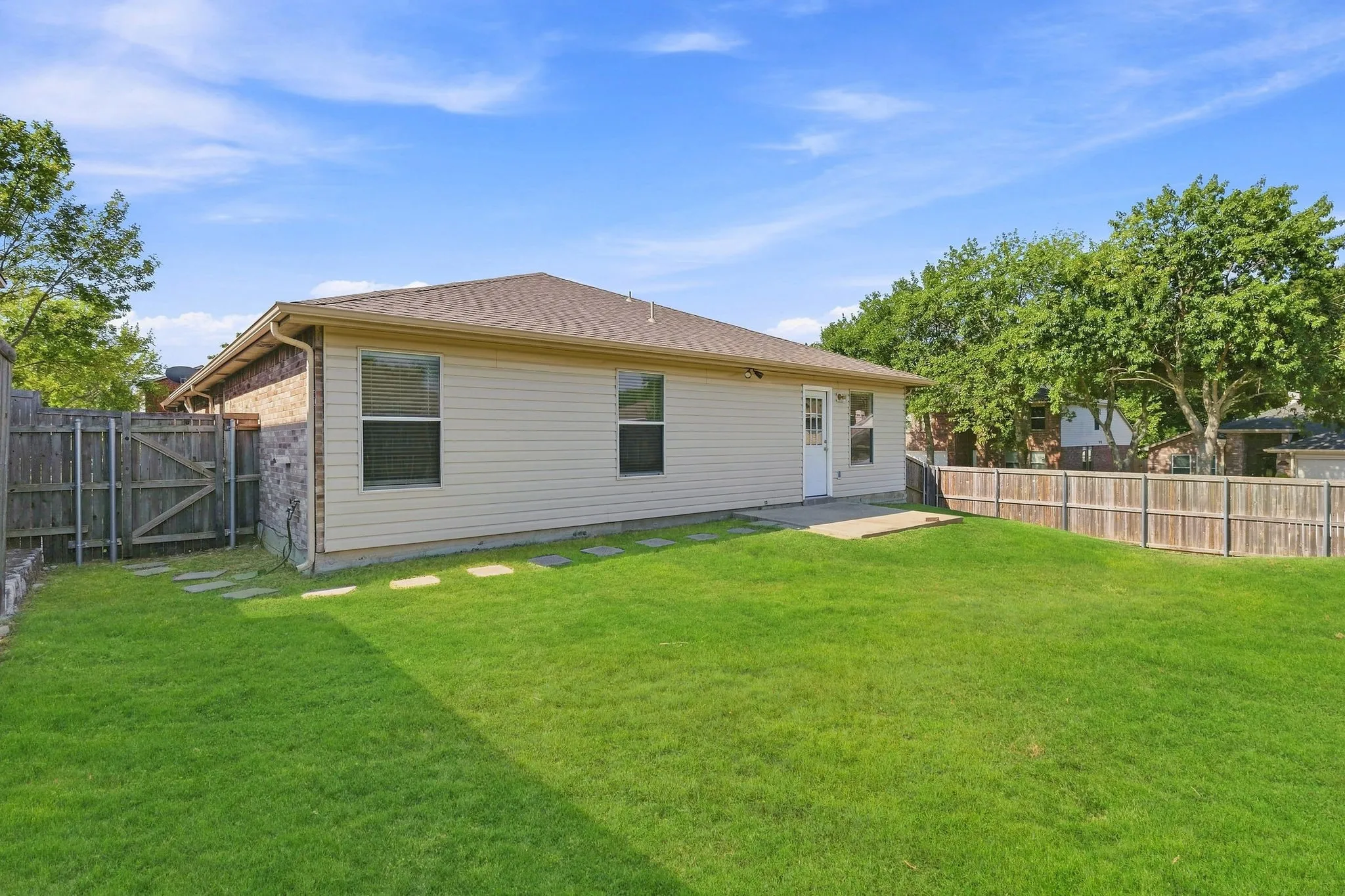 Fenced backyard provides a nice amount of green space with room to relax, play or personalize for outdoor living.