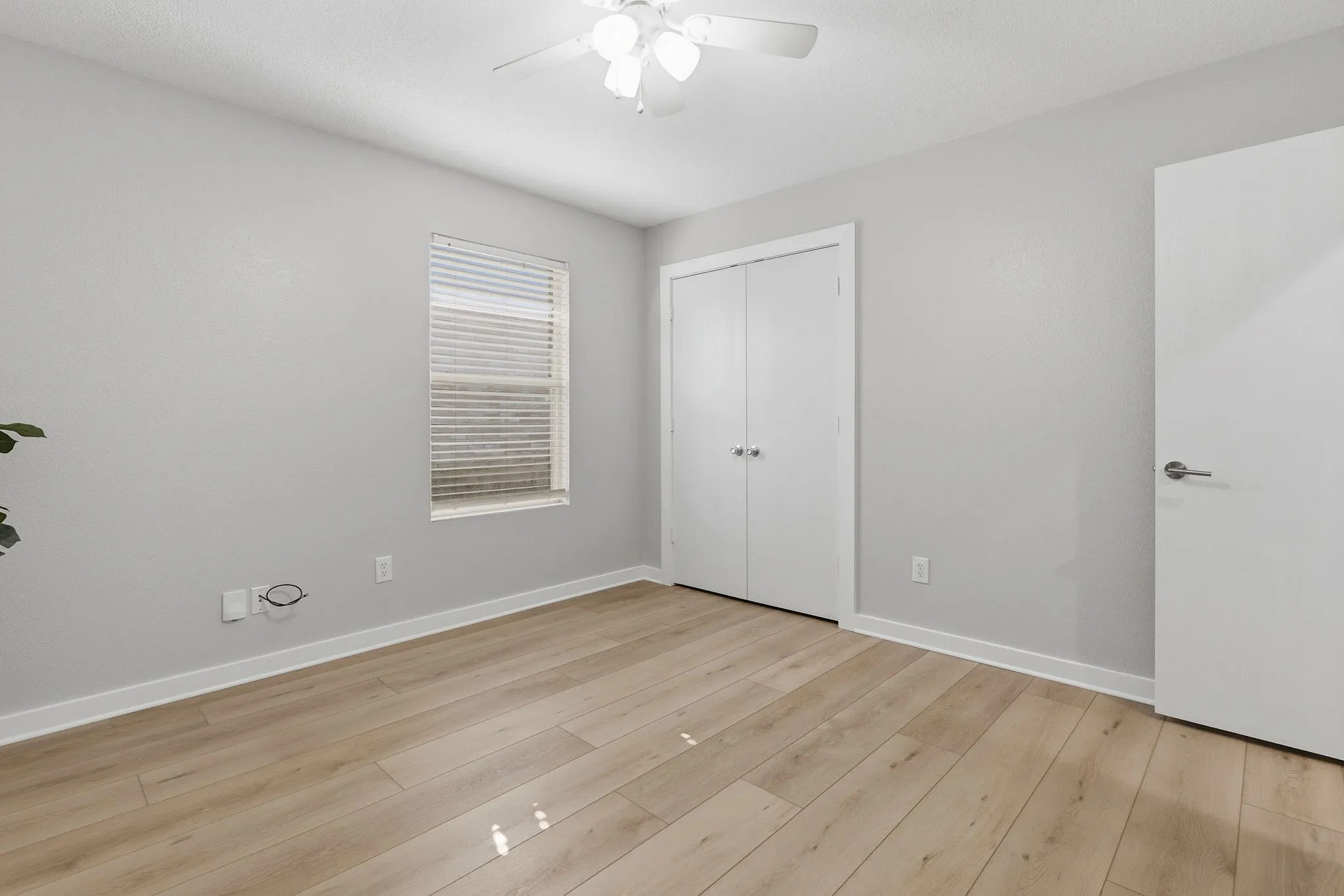 Alternate view showcases the bedroom’s closet, generous floor space and clean updated finishes.