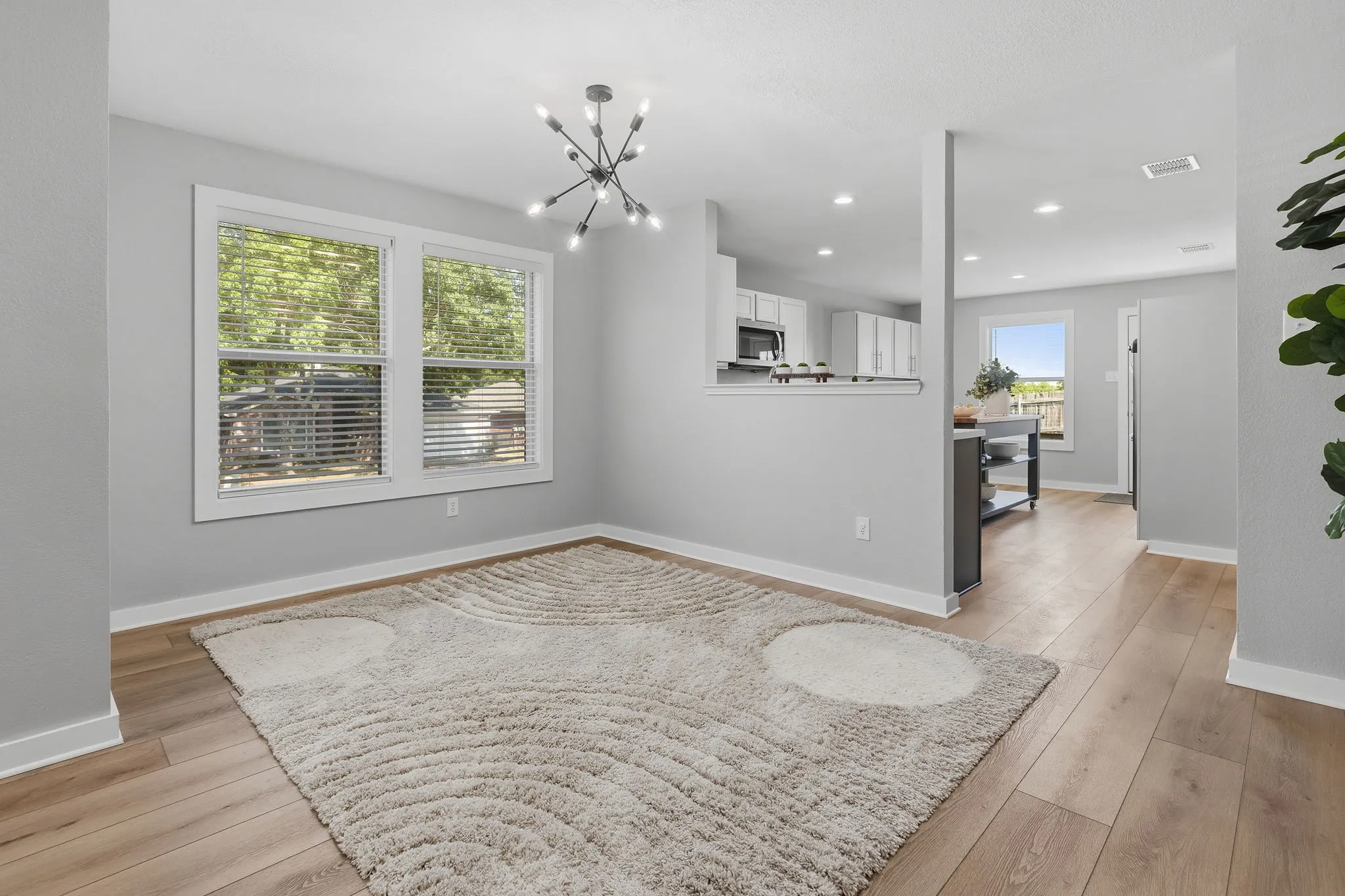 Alternate view highlights the open flow from the dining area into the updated kitchen, creating an easy layout for everyday living and entertaining.