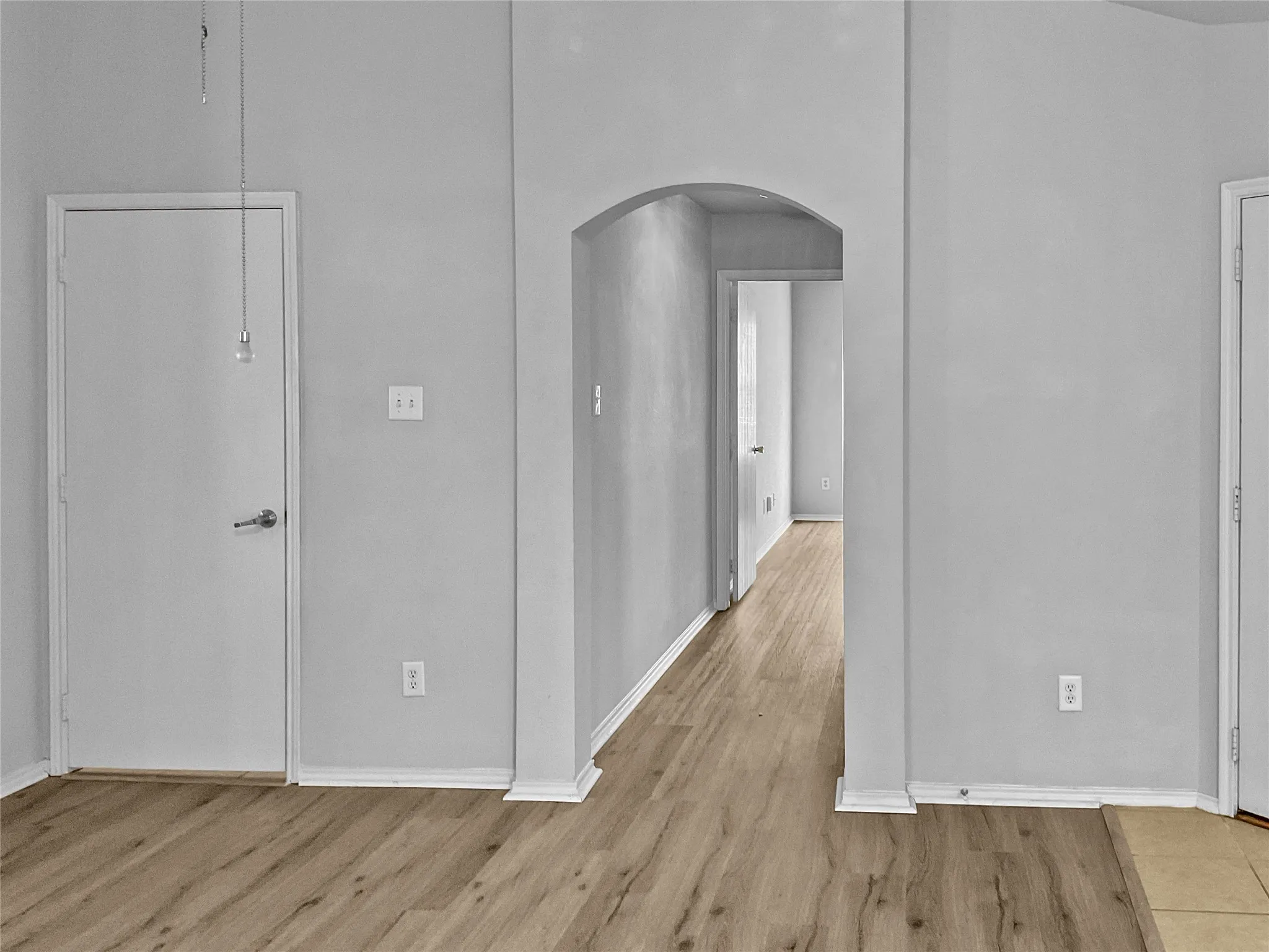 Hallway featuring light wood-type flooring