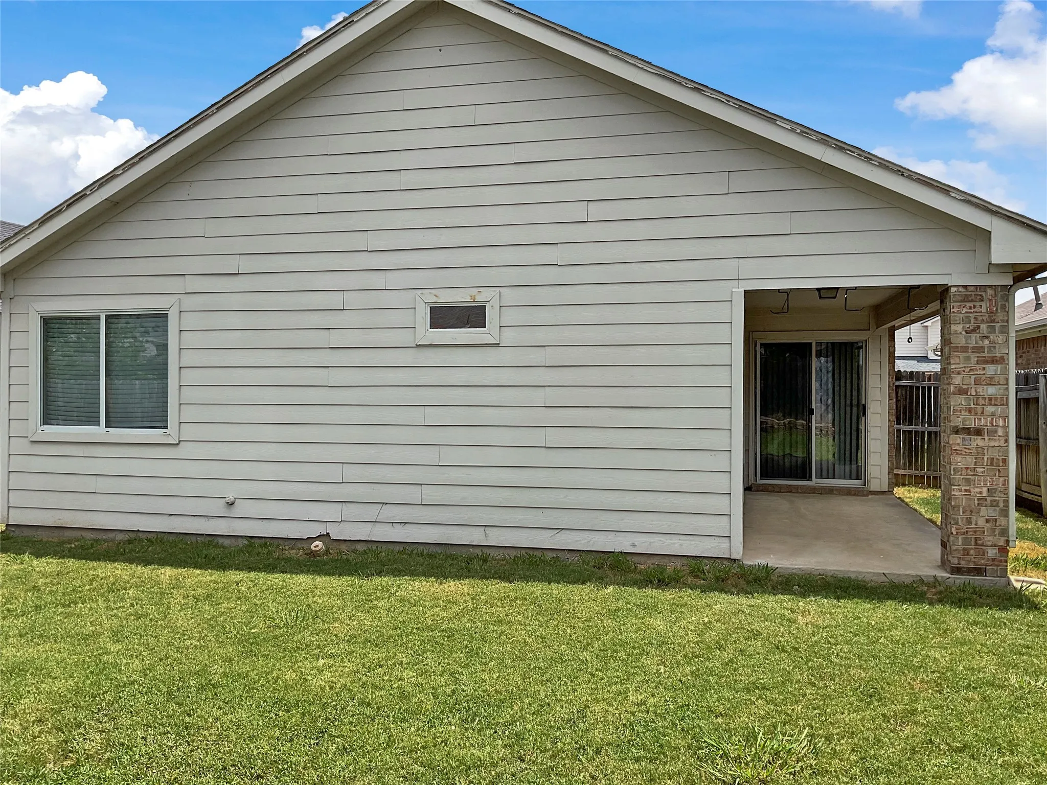 View of home's exterior with a lawn