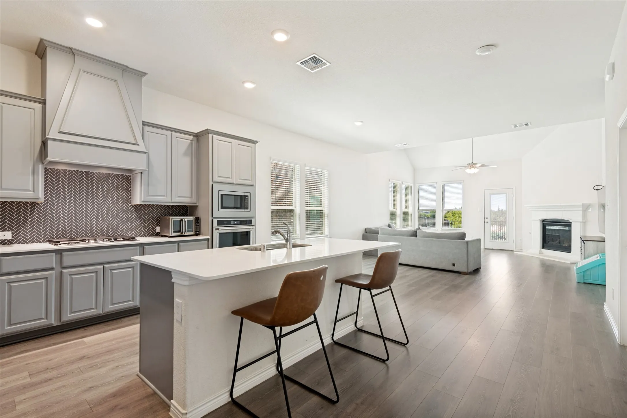 Spacious kitchen with a large center island, abundant cabinetry and plenty of room for gathering and entertaining.
