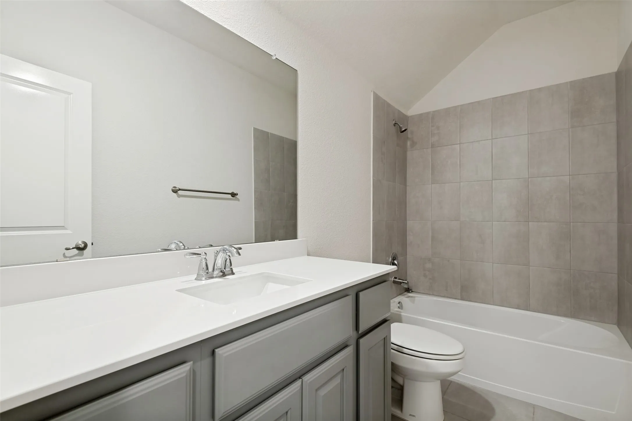 Well-designed secondary bath with plenty of vanity counter space and cabinetry for added storage.