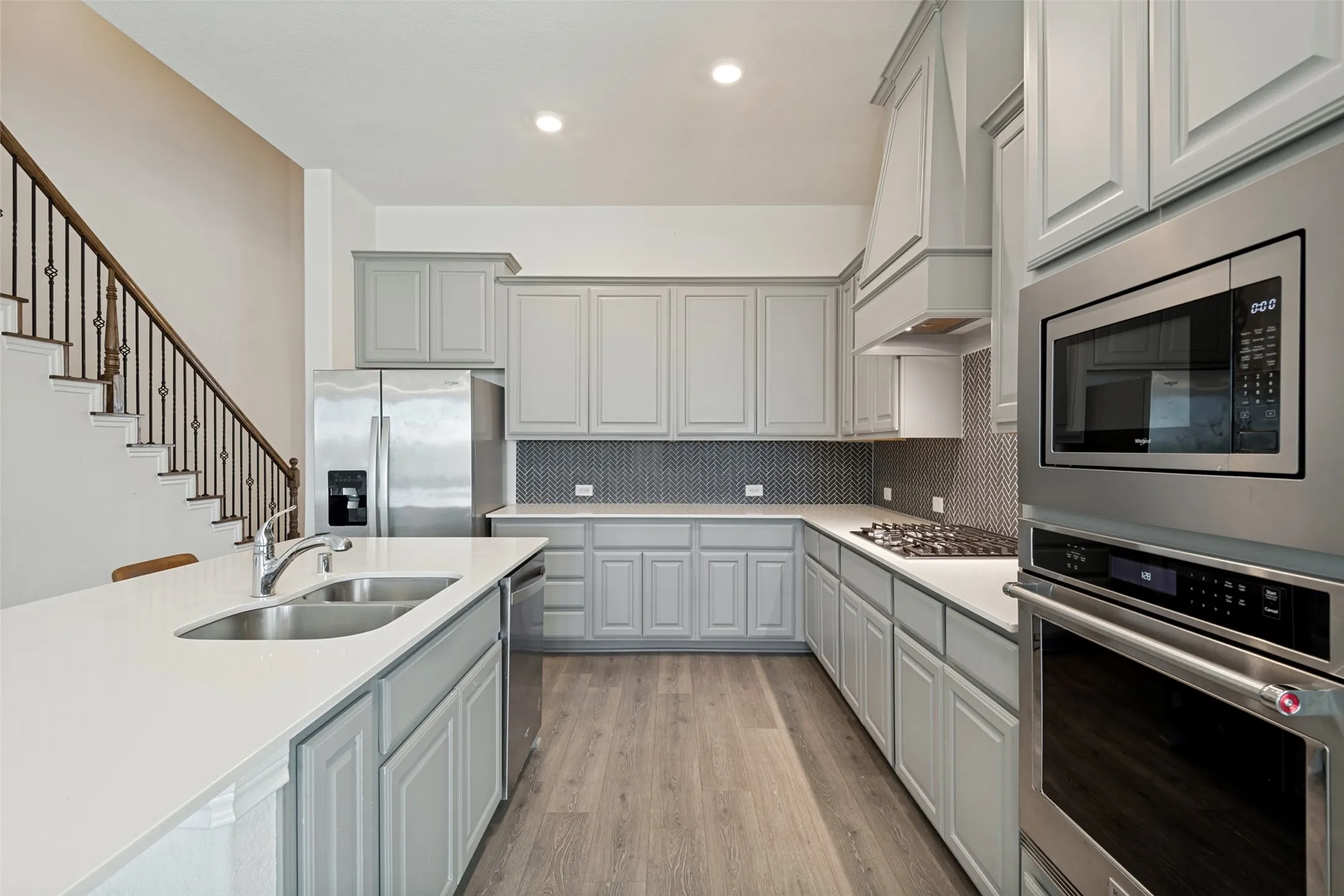 Well-appointed kitchen with stainless steel appliances, ample cabinetry and plenty of counter space.