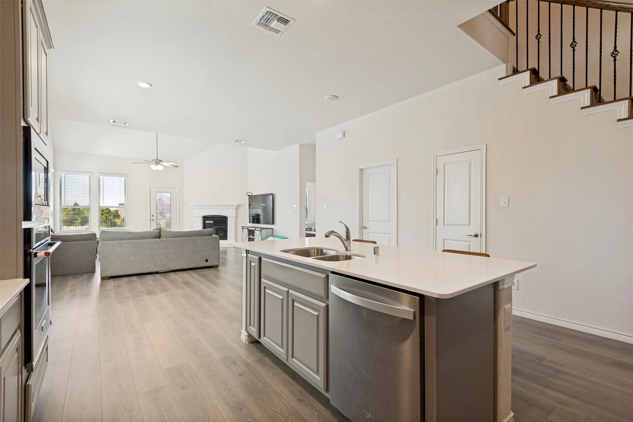 Large kitchen island provides plenty of prep space and additional seating for casual dining