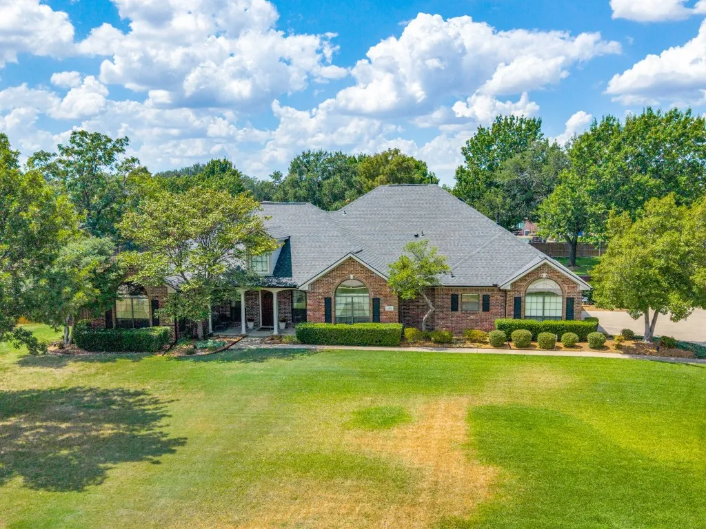 Gorgeous curb appeal to this single story Custom home on a .71 acre lot with mature trees and landscaping!