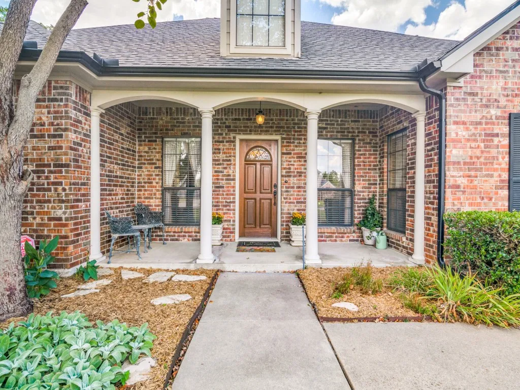 Welcoming front entry with arches and columns.