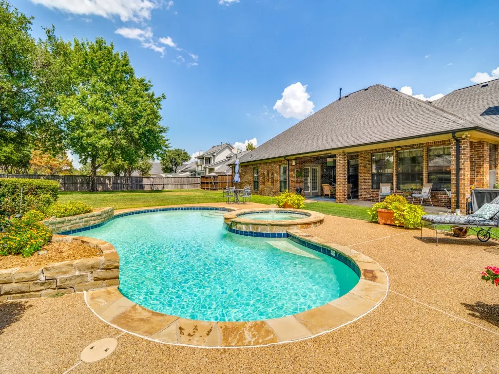 View from the pool towards the extended covered patio.