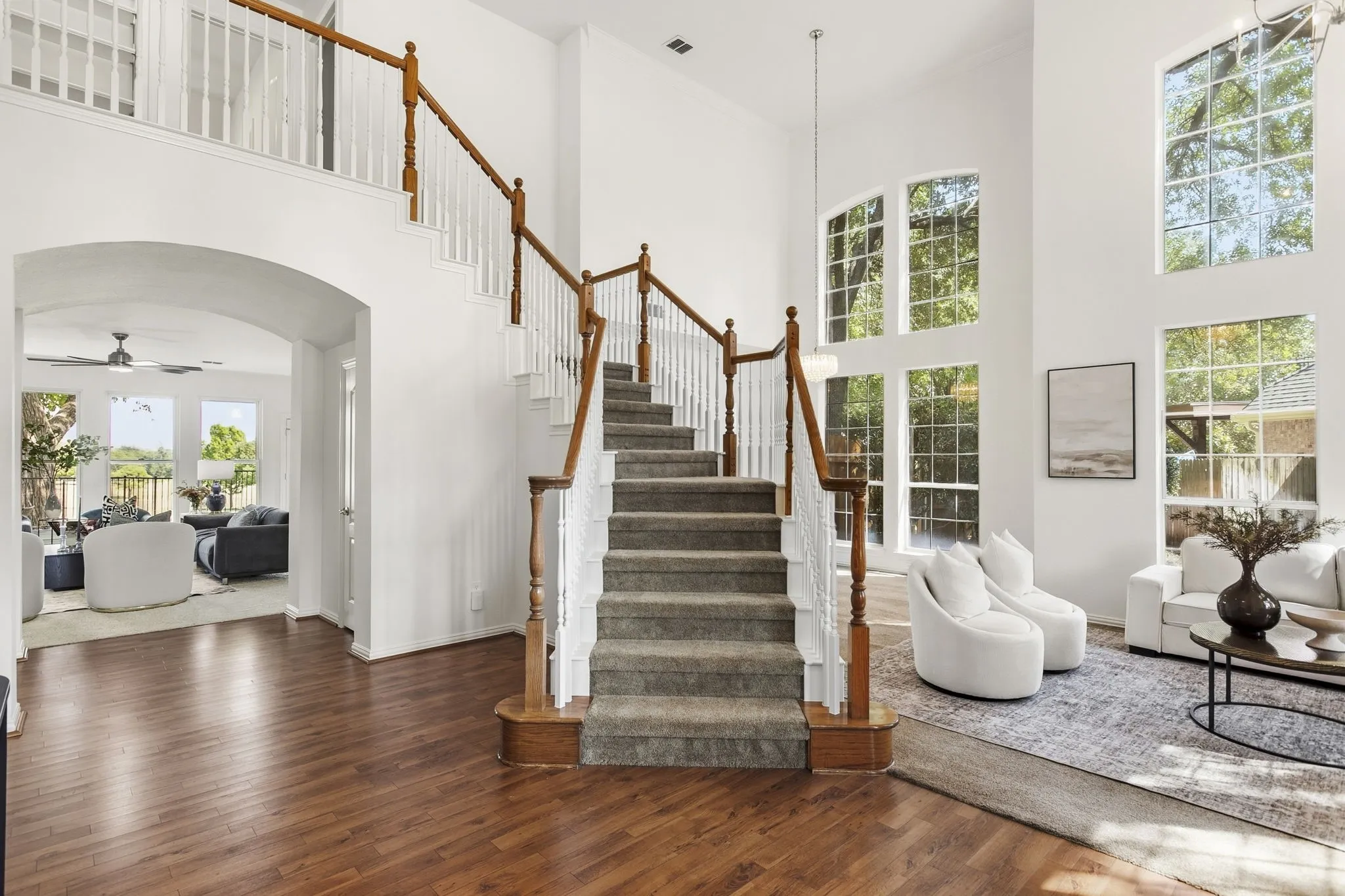 Entry is open and grand! with the formal living room on your right and straight a head an amazing view of the golf course the minute you walk through the front door! Grand windows and open space allow natural light to bounce off walls.