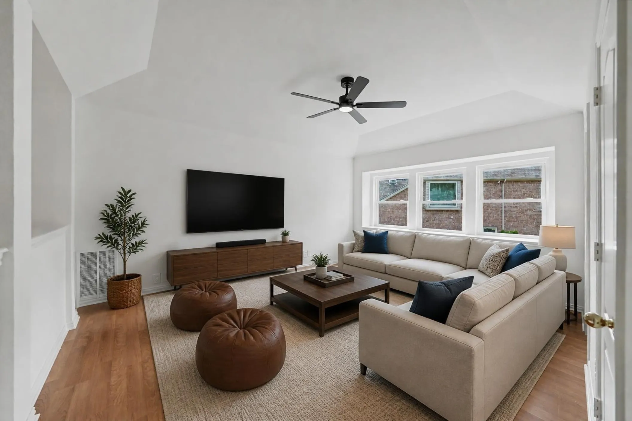 Virtually Staged Loft/Living Room 3 ceiling fan, light wood type finish flooring, a series of windows, new ceiling fan and refreshed!