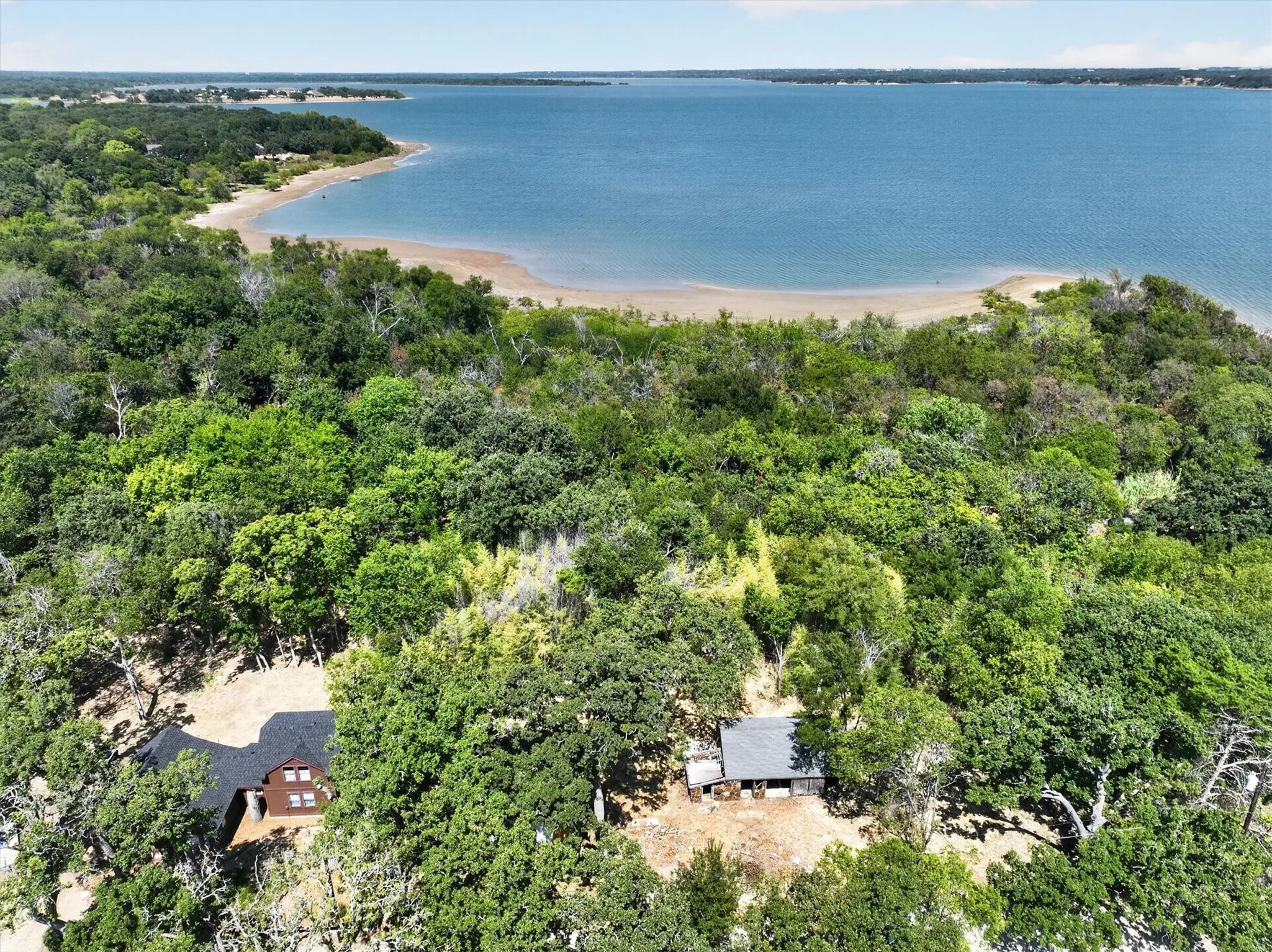Expansive body of water with a sandy shoreline