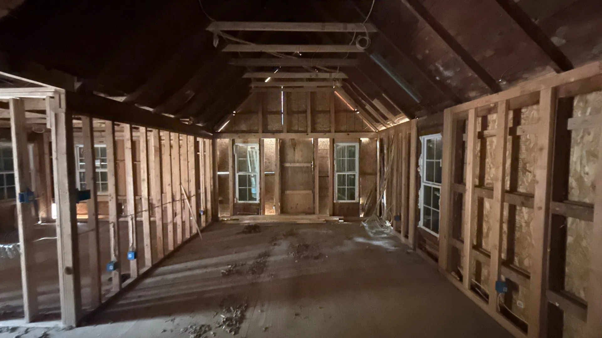 Exposed wood framing with multiple window openings